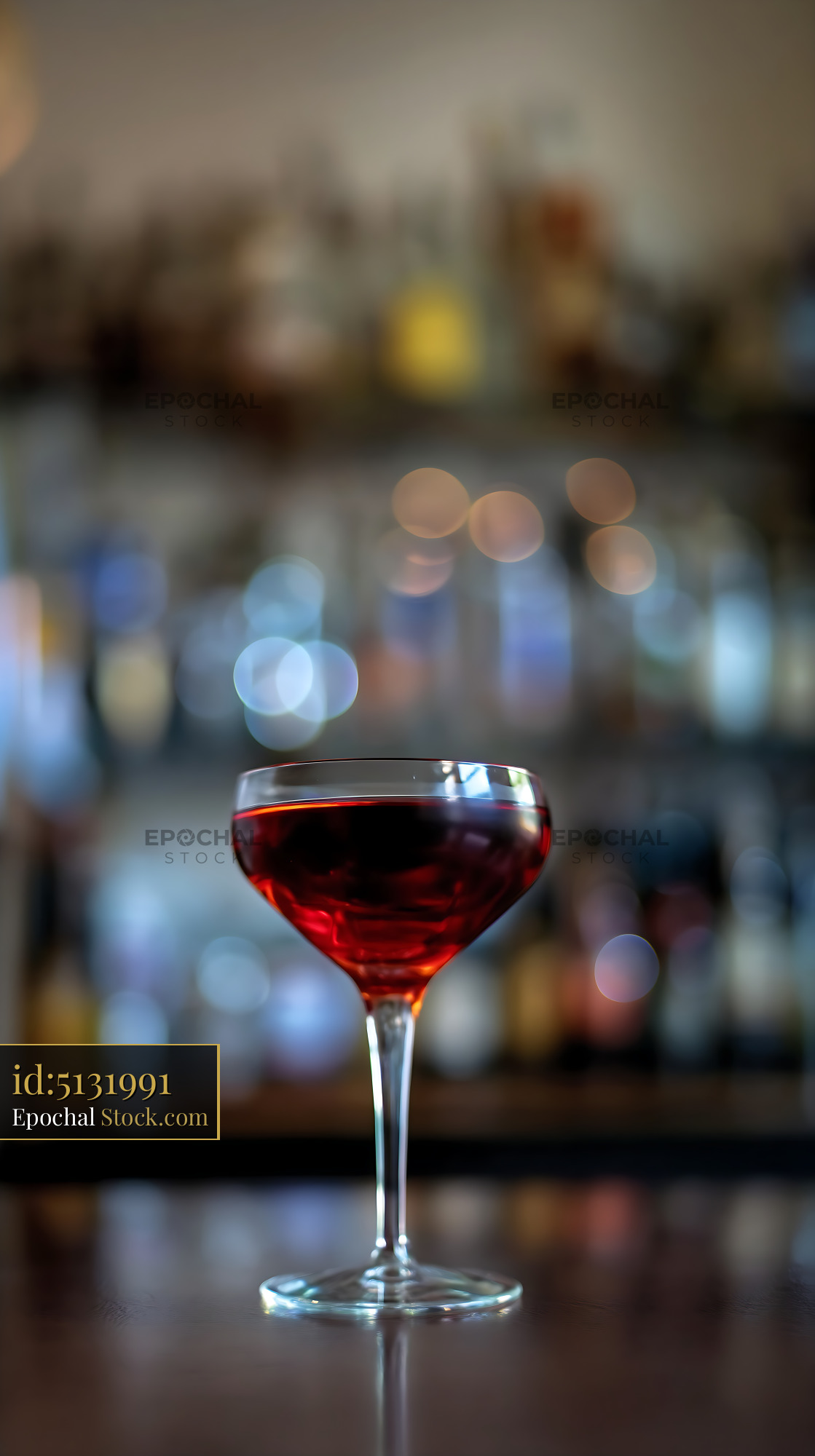 Bushwick Cocktail Glass with Bokeh Bar - stock photo