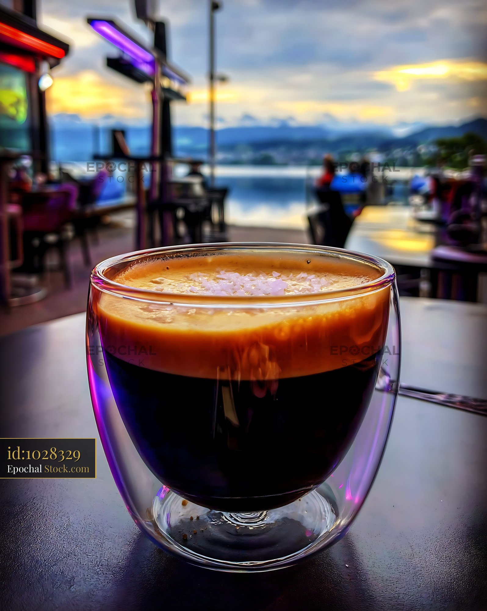 Nitro Caramel Coffee Overlooking Lake at Sunset - stock photo