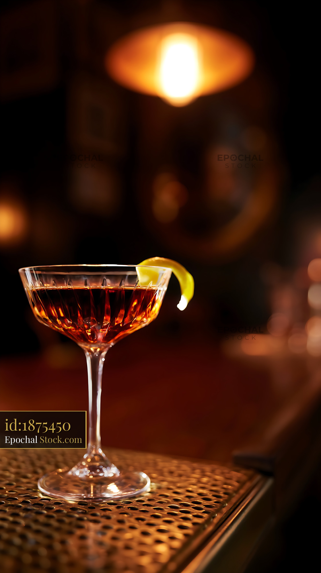 Saratoga Cocktail with Lemon Twist in Bar - stock photo