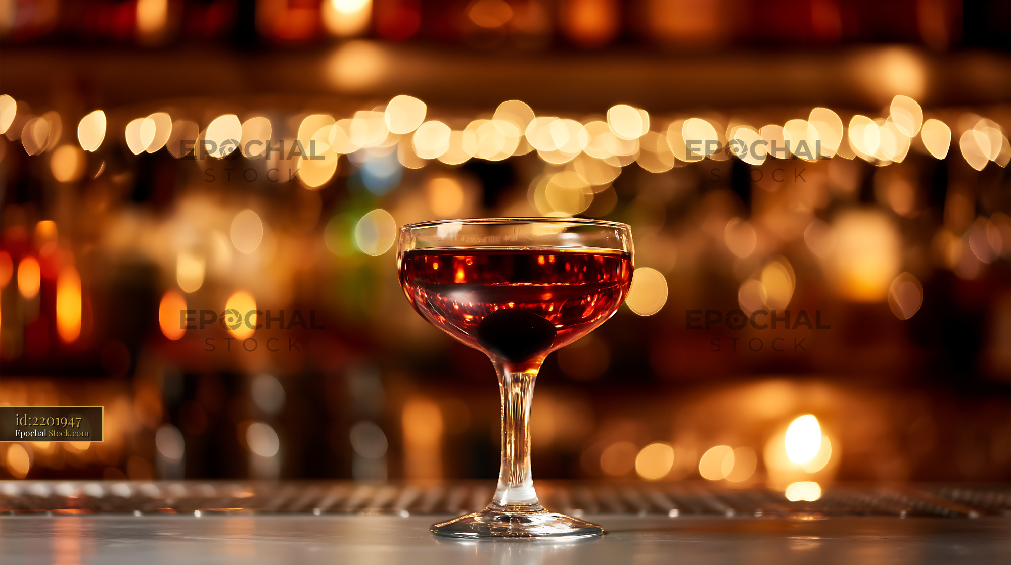 Bushwick Cocktail in Coupe Glass at Bar - stock photo