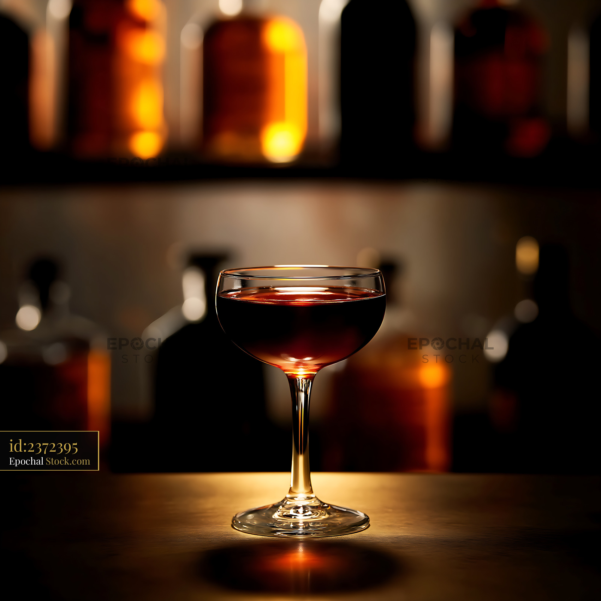 Bushwick Cocktail in Coupe Glass at Bar - stock photo