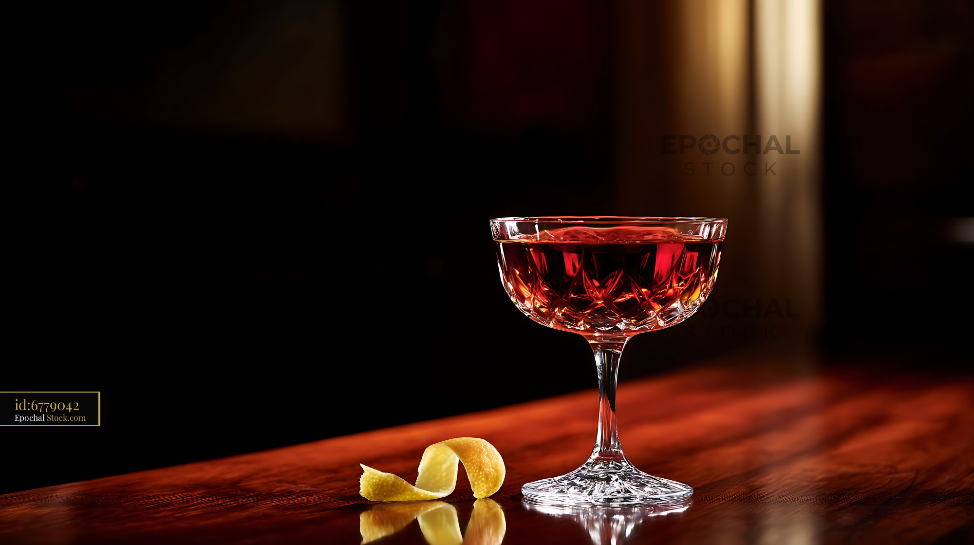 Saratoga Cocktail with Lemon Twist on Dark Wood - stock photo