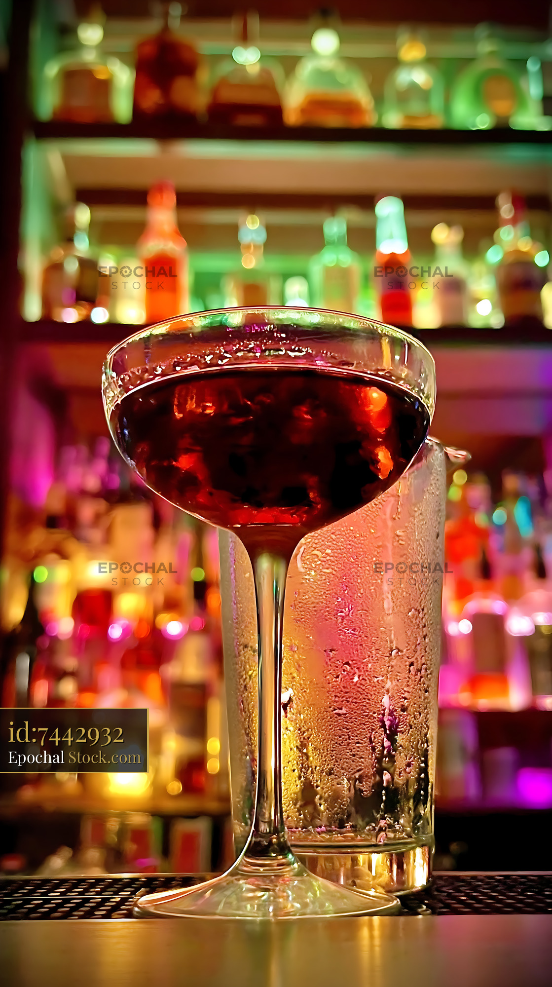 Bushwick Cocktail on Illuminated Bar Counter - stock photo