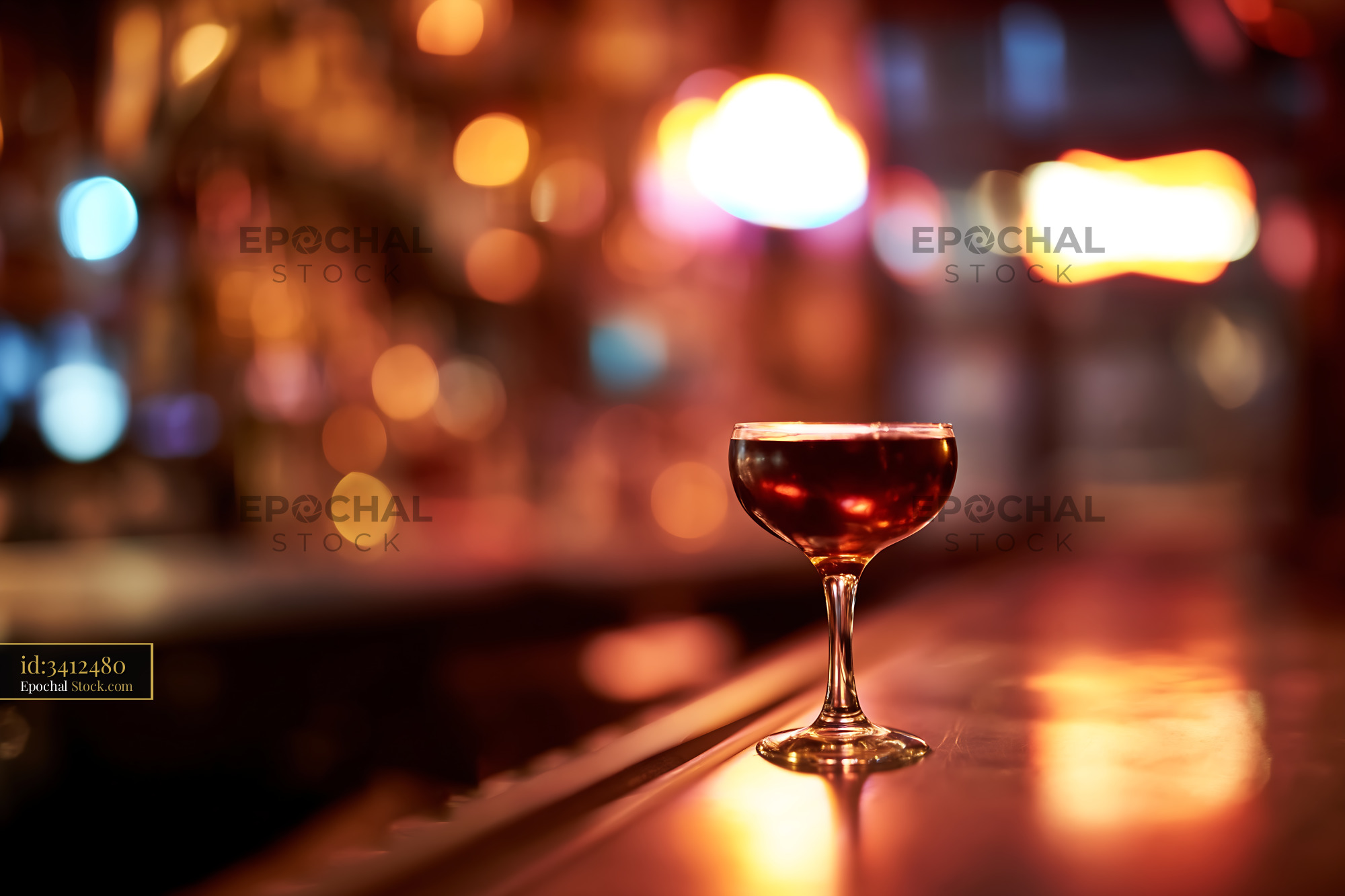Red Cocktail on Elegant Bar Counter at Night - stock photo