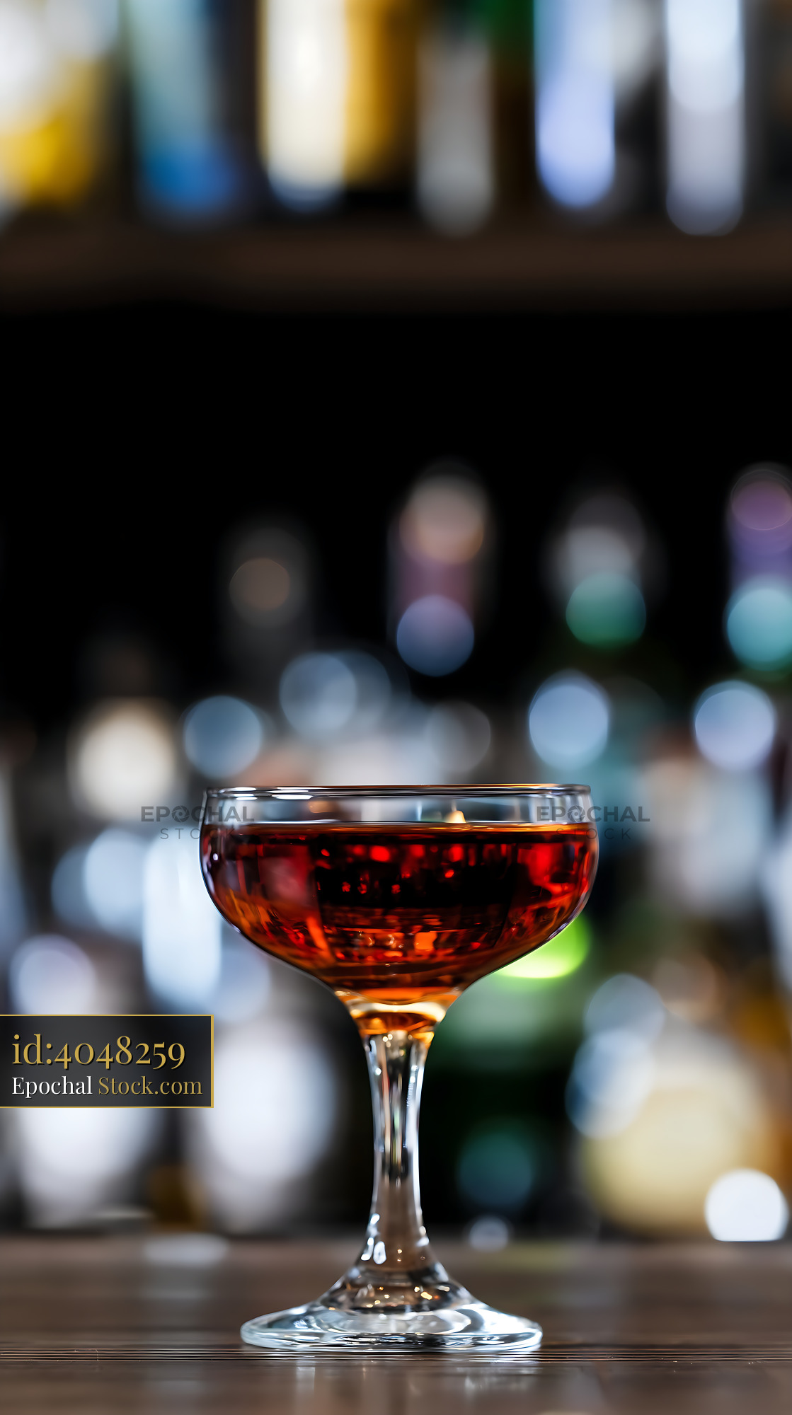 Bushwick Cocktail in Coupe Glass at Bar - stock photo