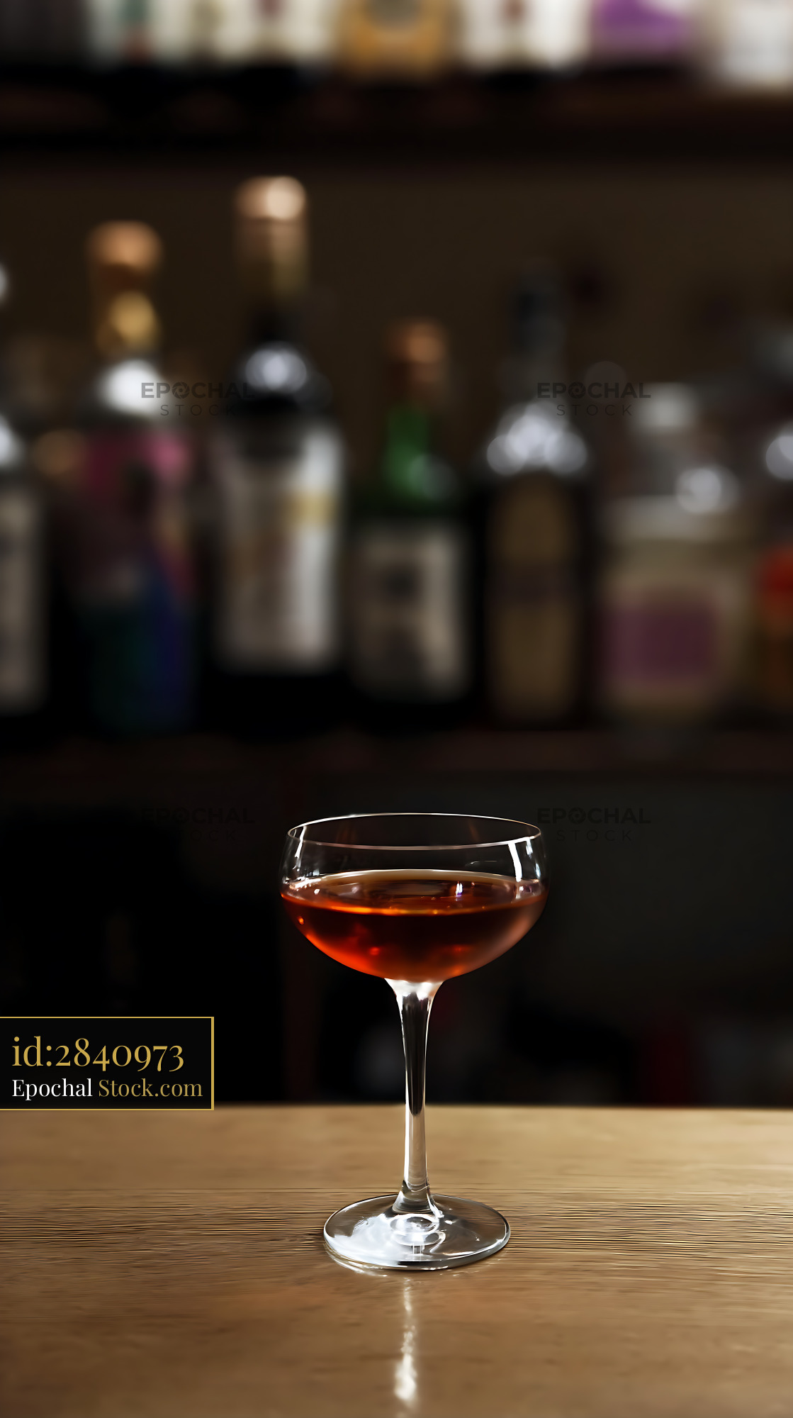 Bushwick Cocktail in Coupe Glass at Bar - stock photo