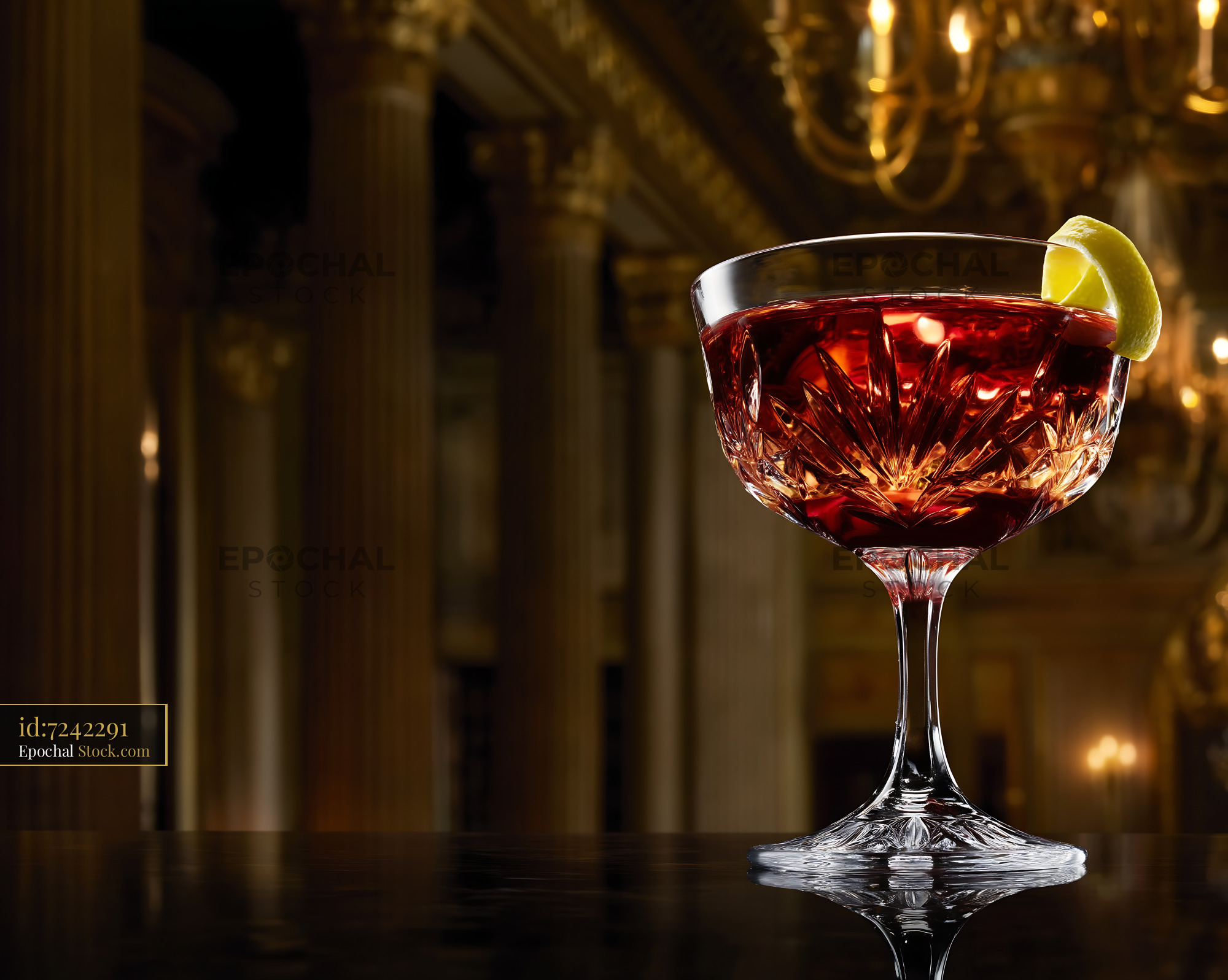 Elegant Red Cocktail with Lime in Coupe Glass - stock photo