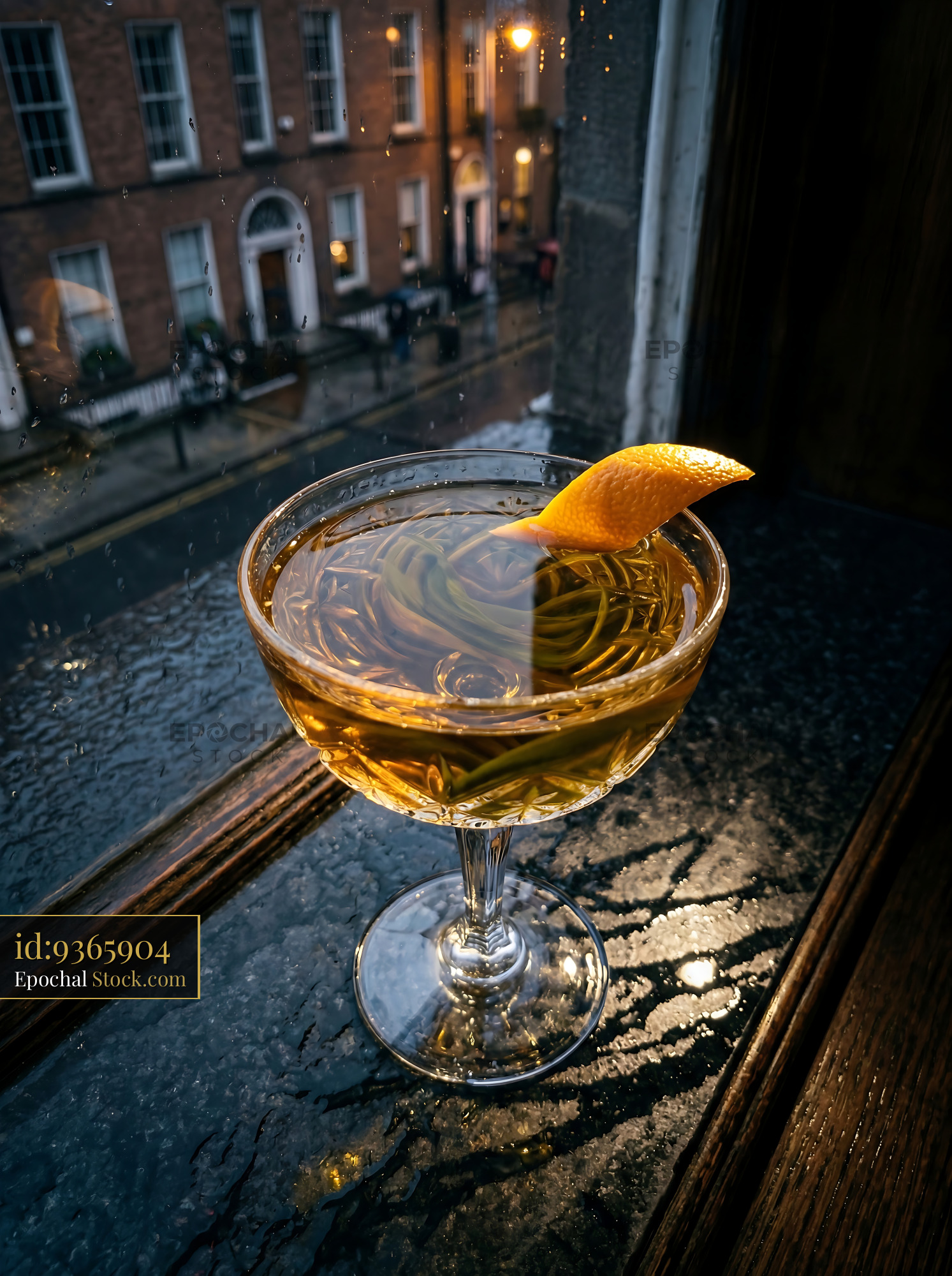 Tipperary Cocktail with Lemon at Rainy Dublin Window - stock photo