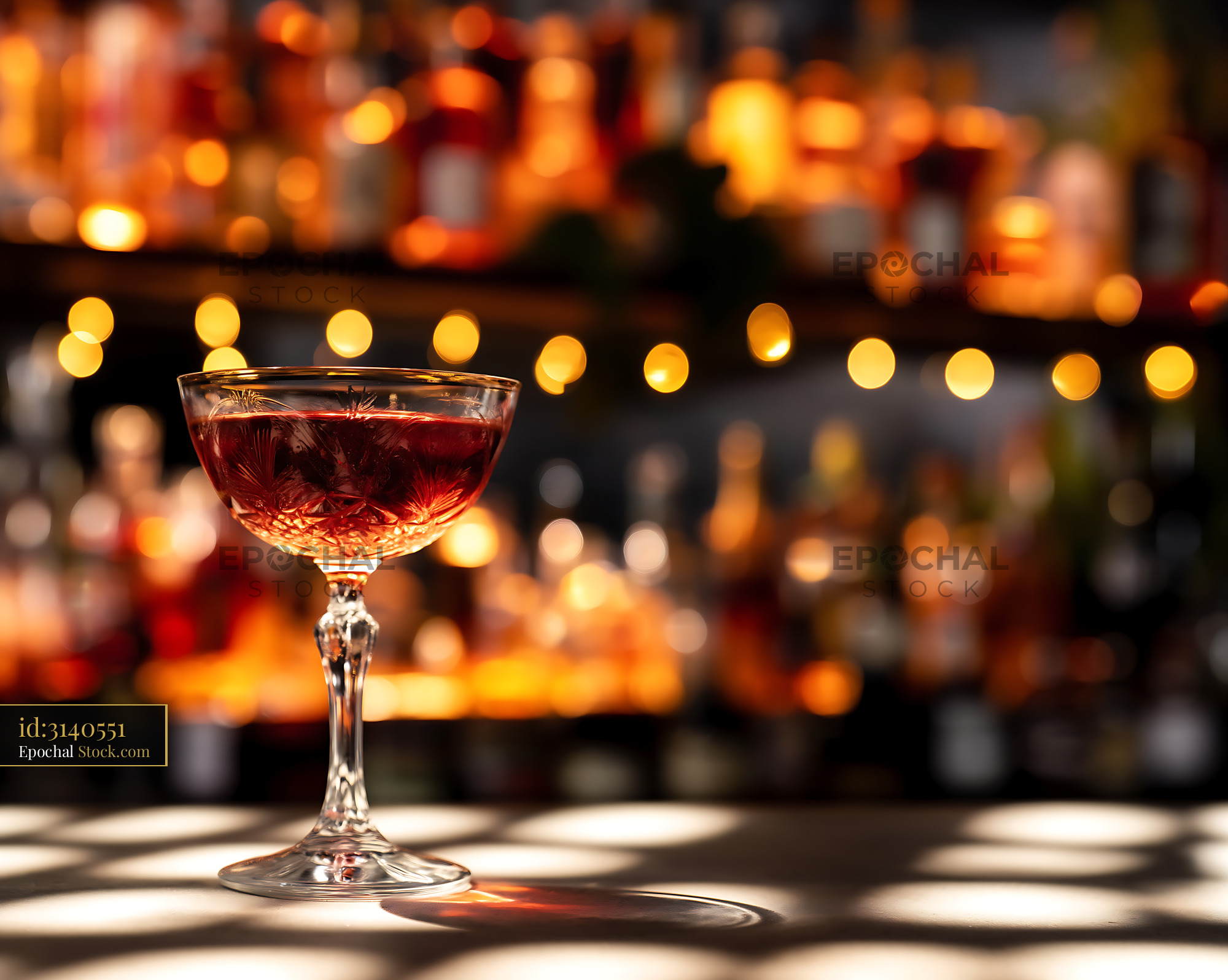 Elegant Red Cocktail at Bar with Warm Bokeh - stock photo