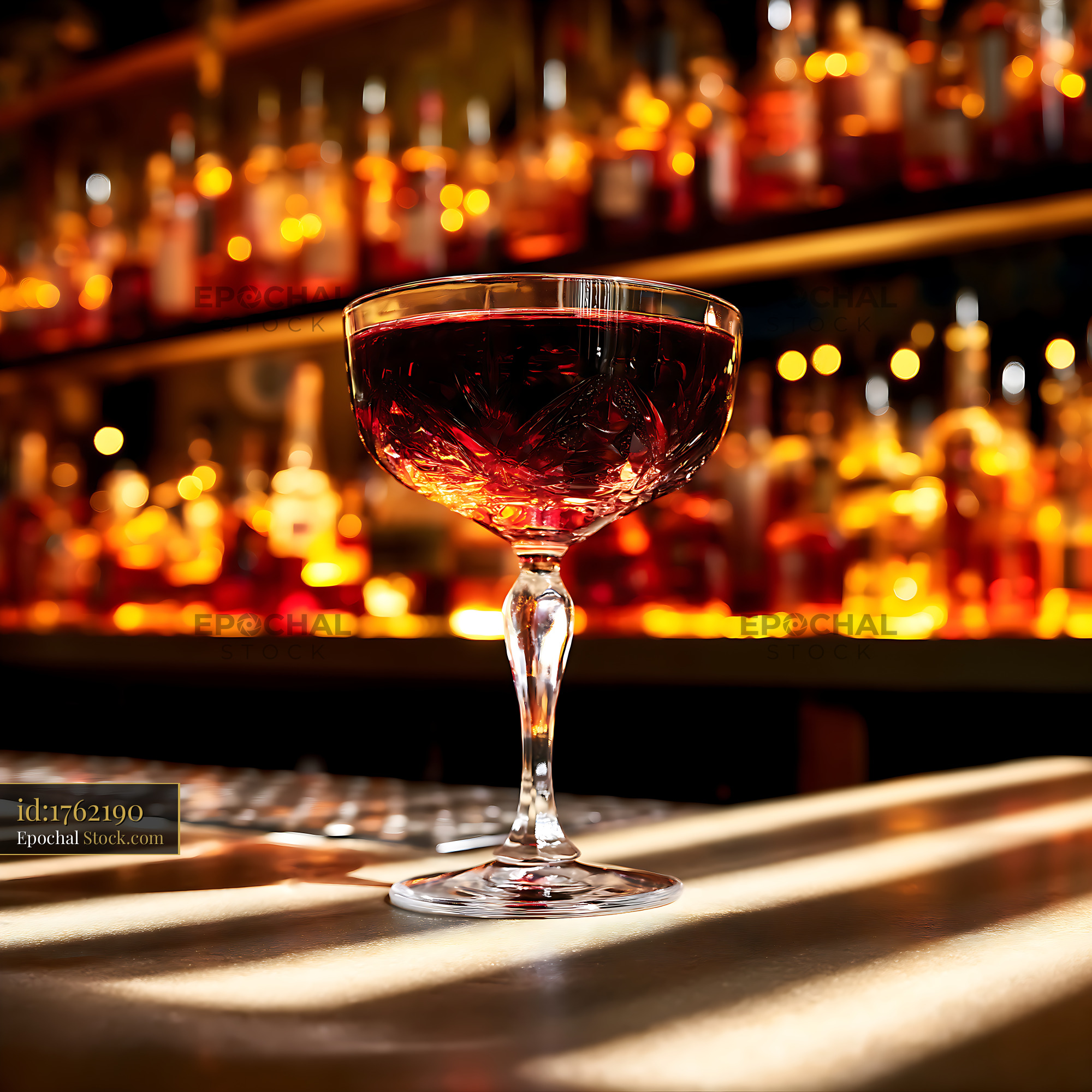 Red Cocktail in Crystal Coupe at Luxury Bar - stock photo