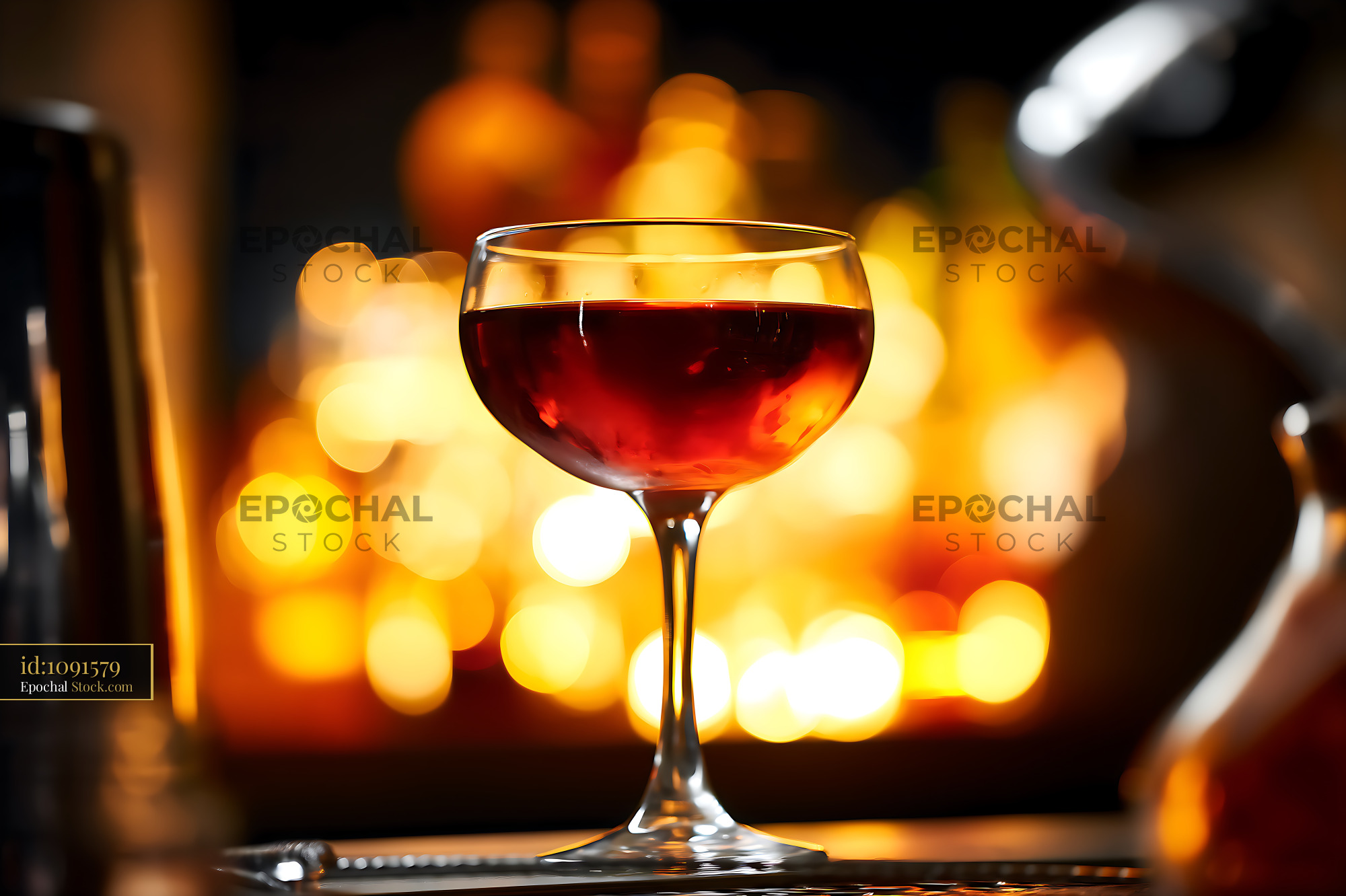 Red Wine Glass in Warm Evening Ambiance - stock photo