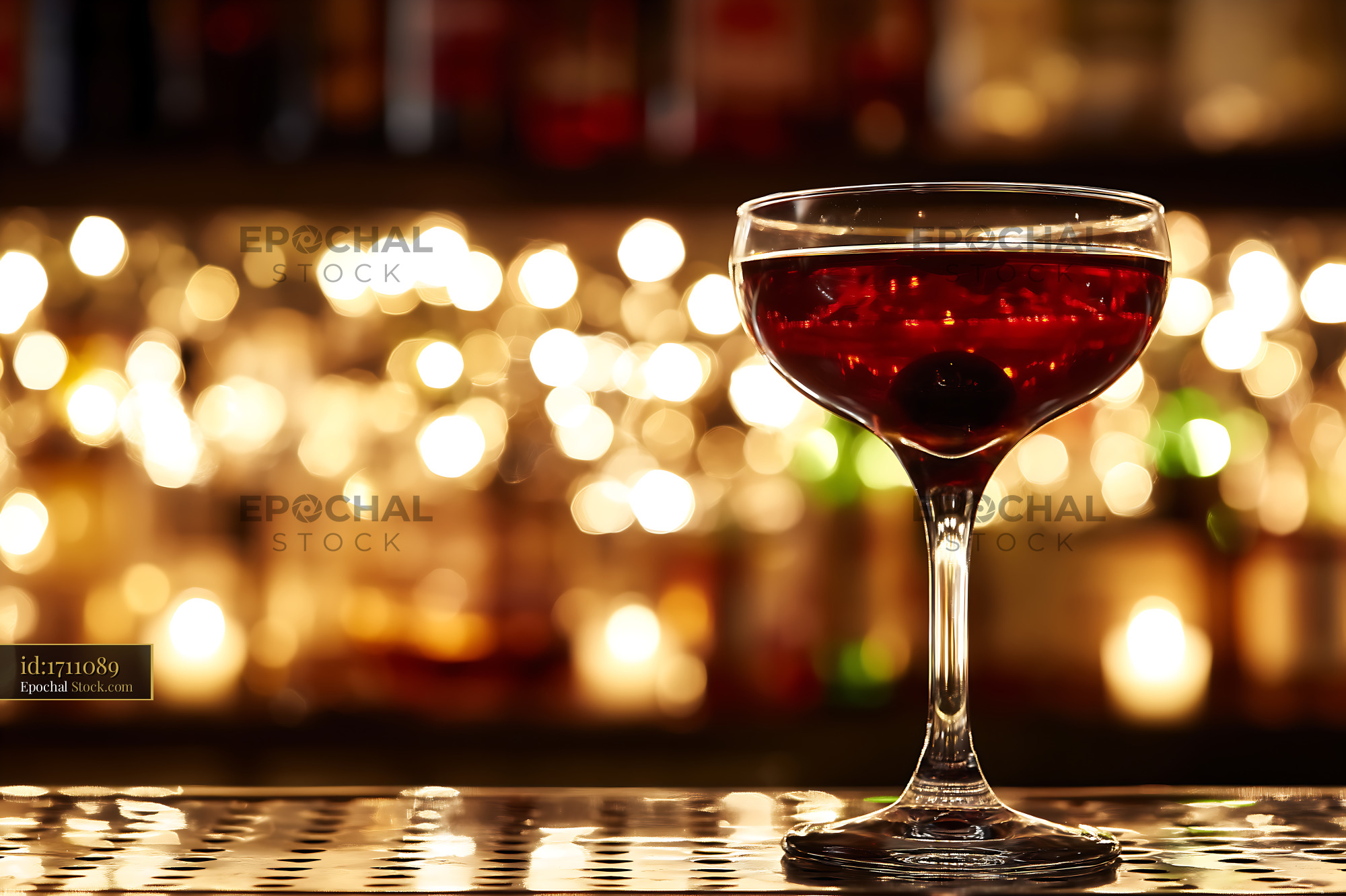 Bushwick Cocktail in Coupe Glass at Bar - stock photo