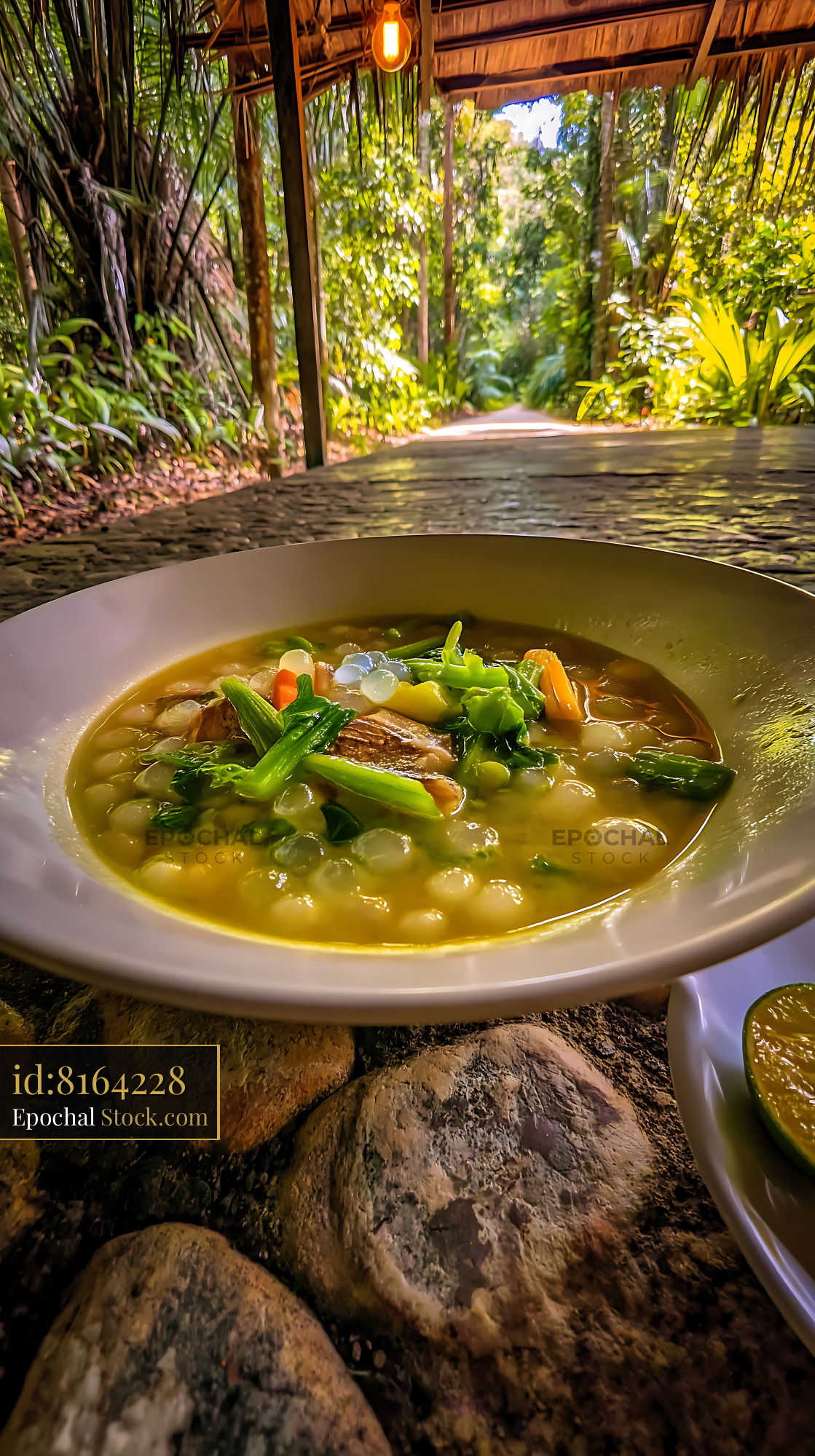 Delicious Lor Mee Soup Amidst Vibrant Jungle Paradise - stock photo