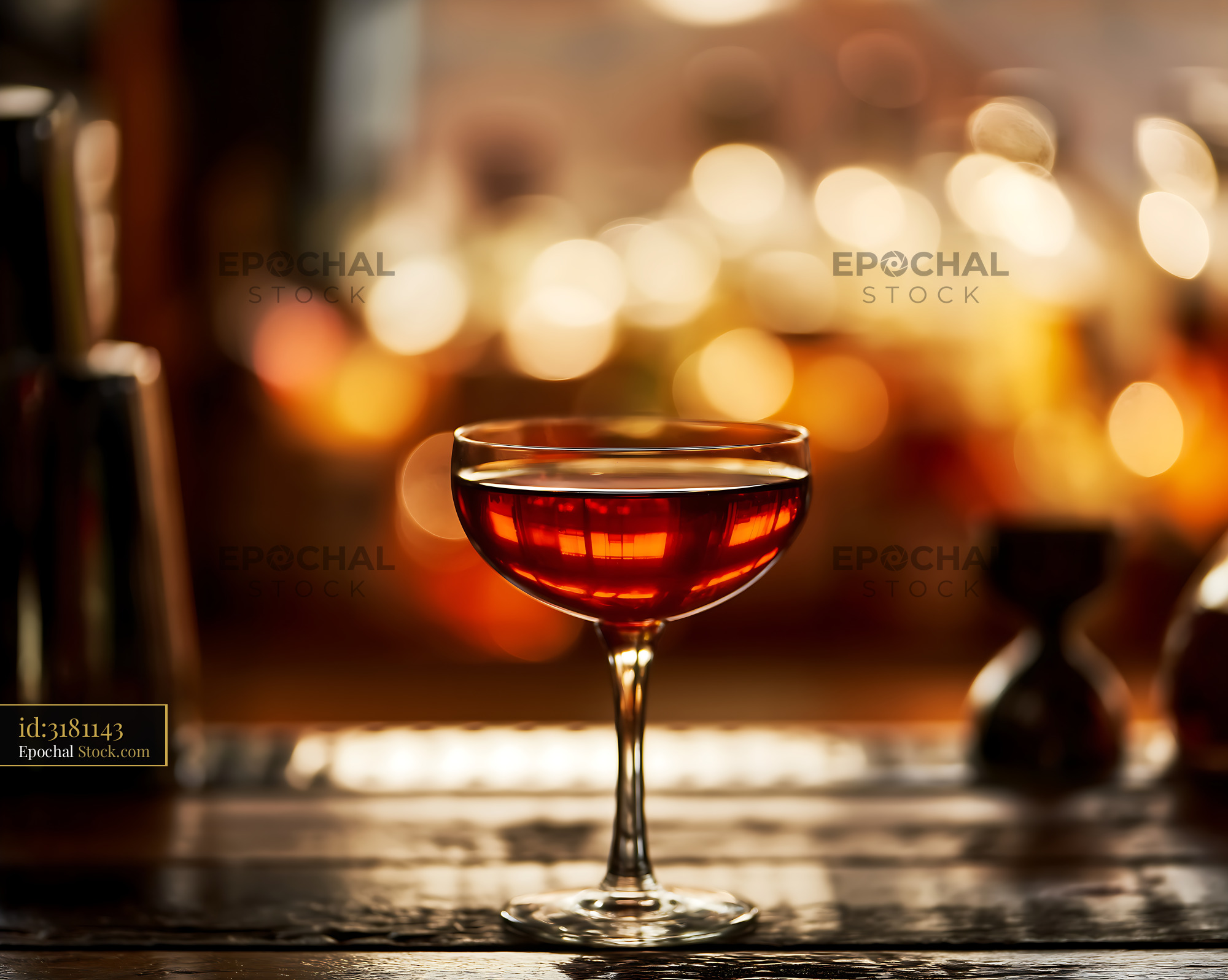 Bushwick Cocktail in Coupe Glass at Bar - stock photo