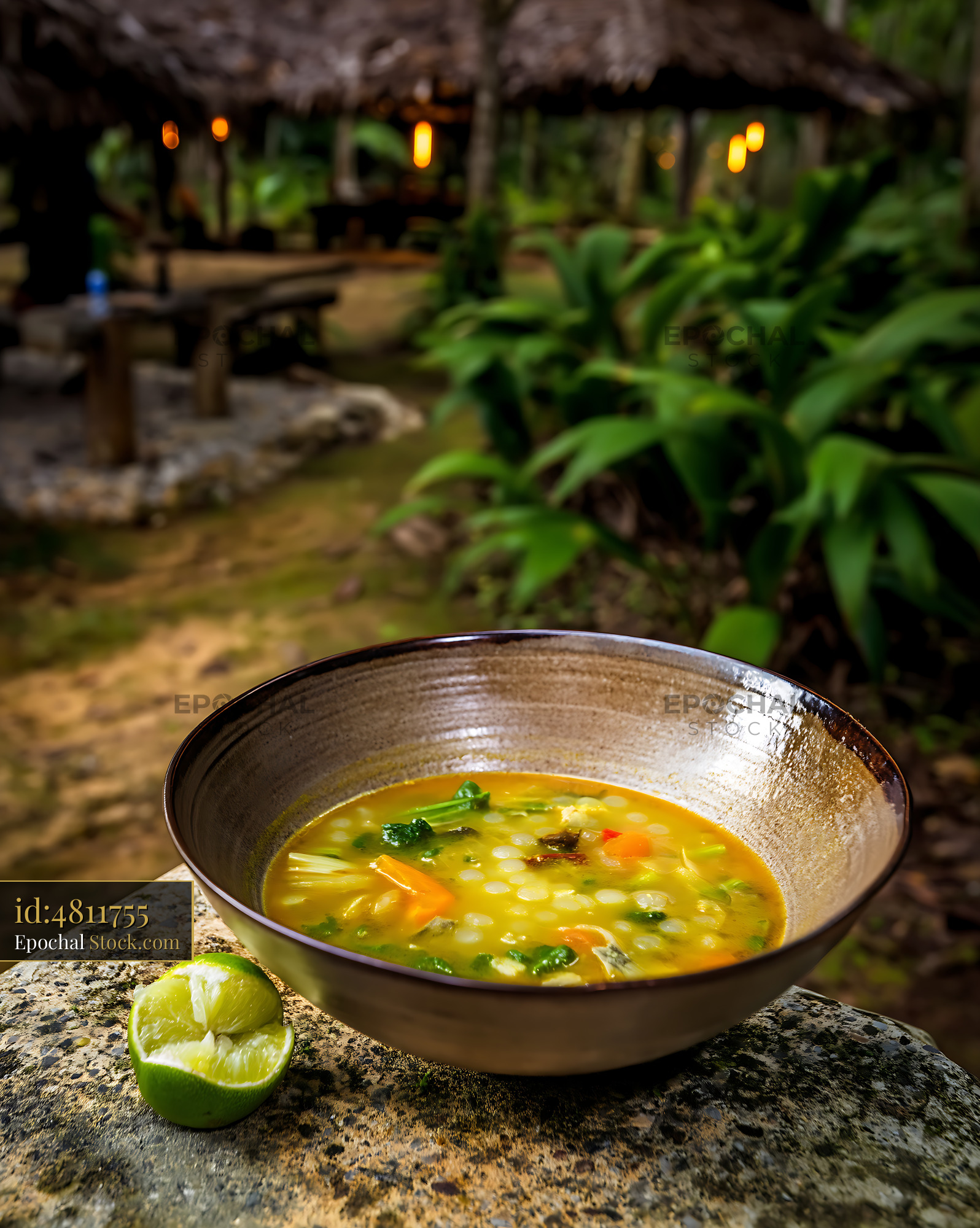 Kapurung Soup with Lime in Tropical Outdoor Setting - stock photo