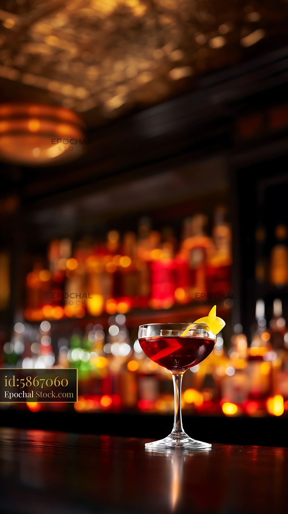 Bushwick Cocktail with Lemon Twist at Bar - stock photo