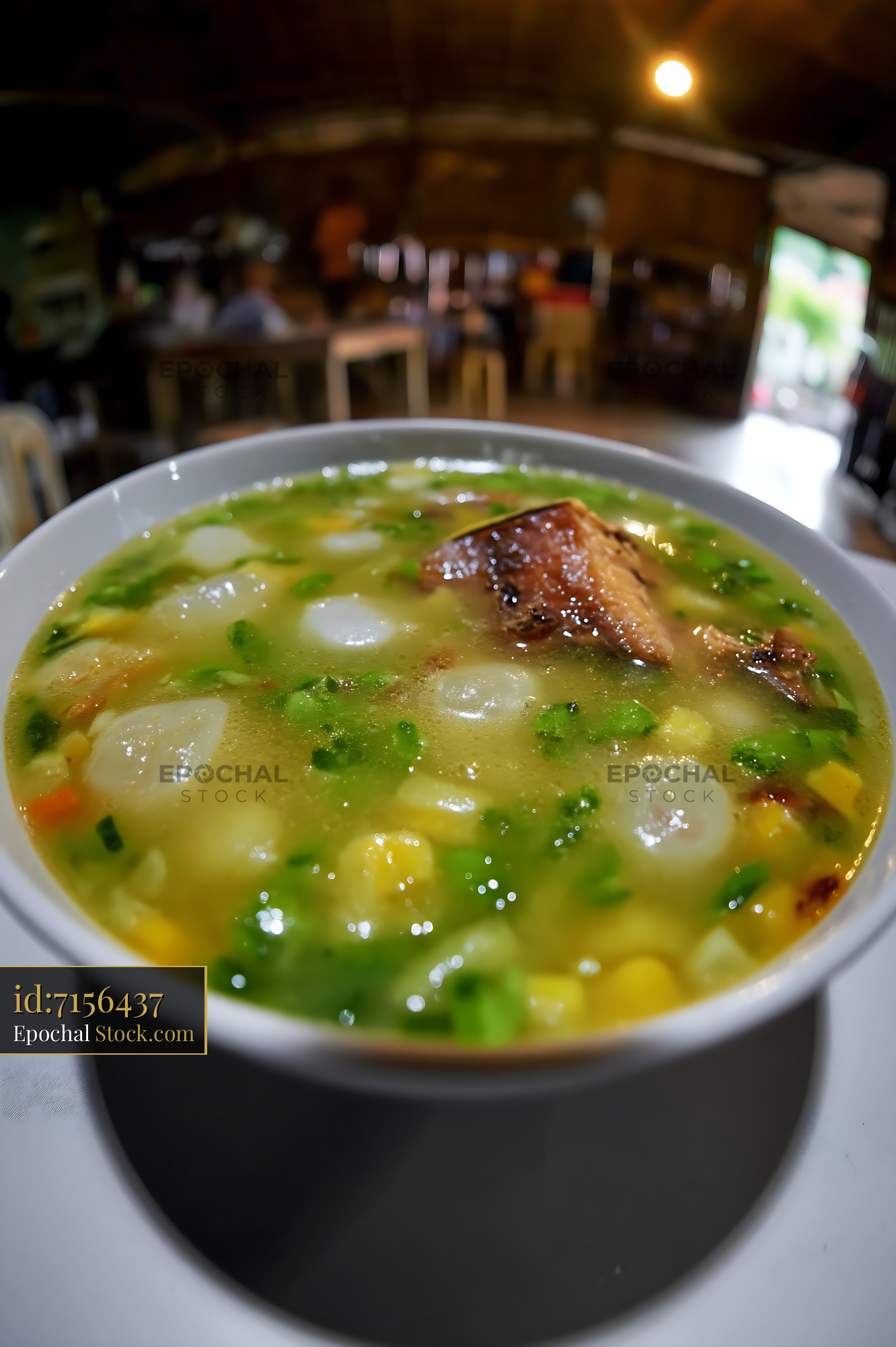 Hearty Lor Mee Soup with Pork Belly in Warm Restaurant - stock photo