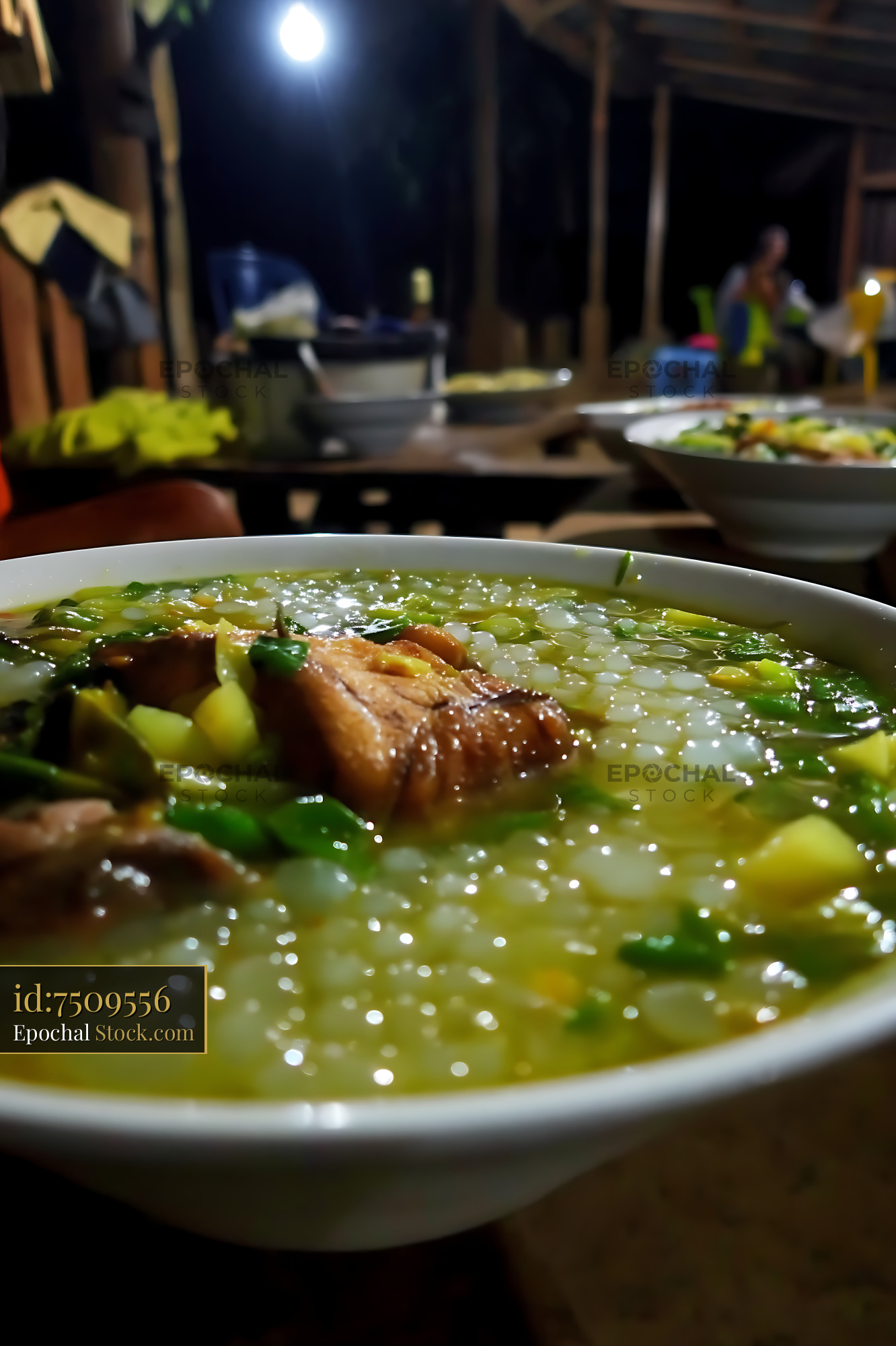 Hearty Lor Mee Soup with Meat and Greens at Night - stock photo
