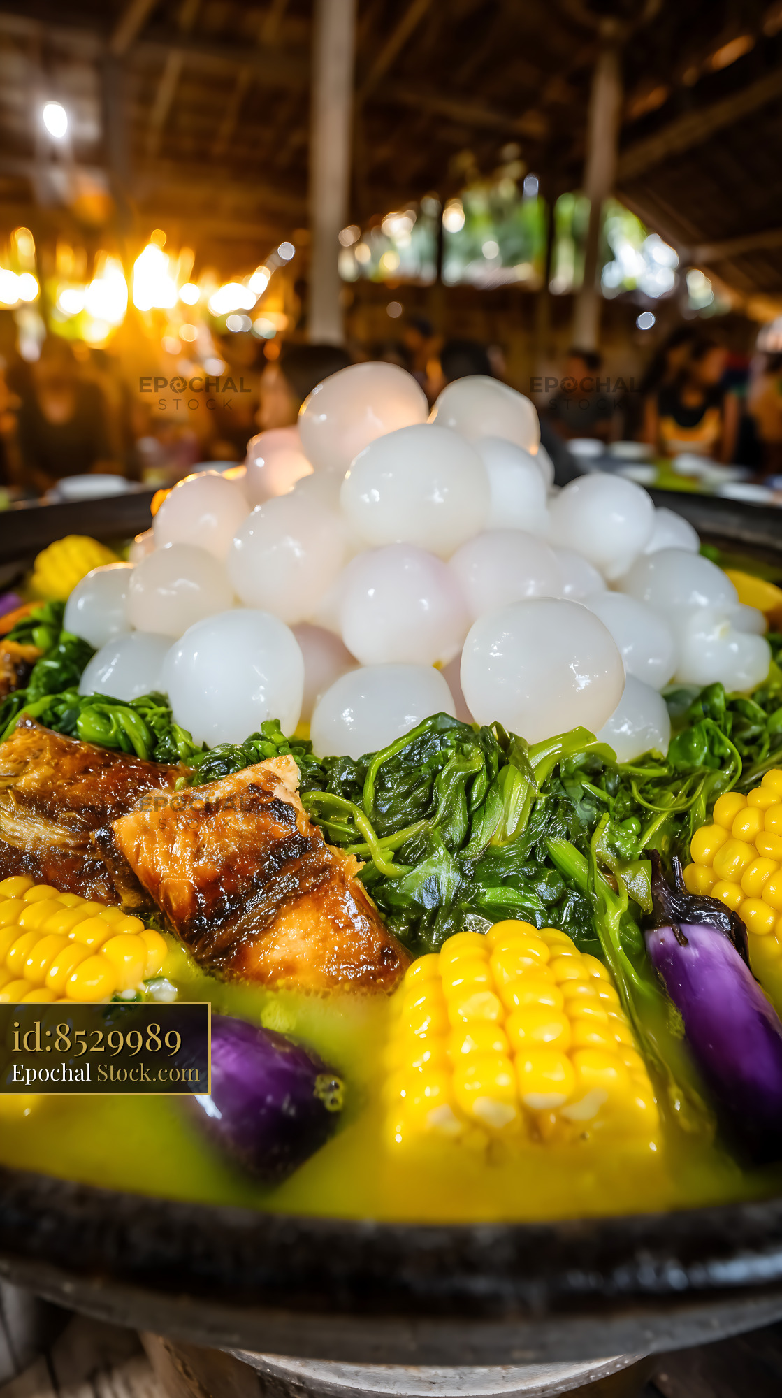 Hearty Lor Mee Soup with Fish, Corn, and Vegetables - stock photo