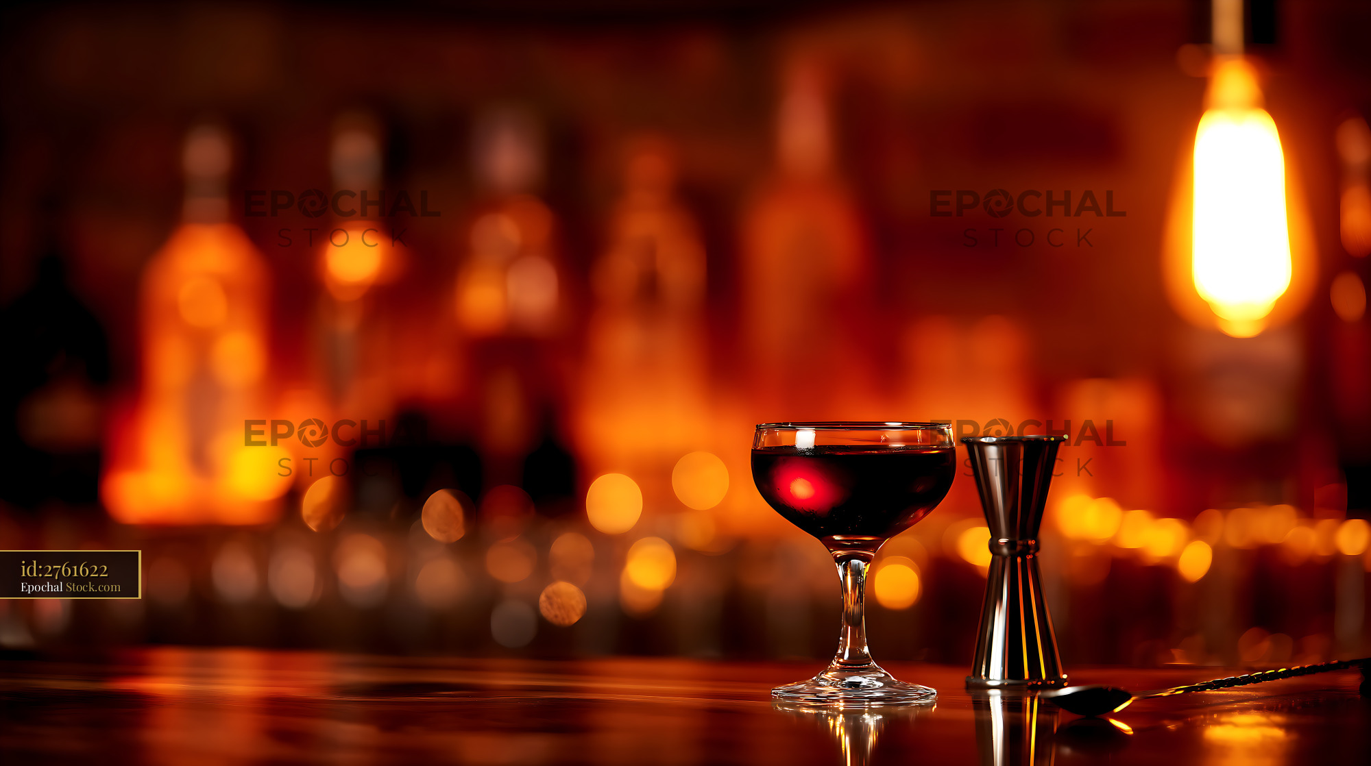 Craft Cocktail with Jigger in Elegant Bar Glow - stock photo