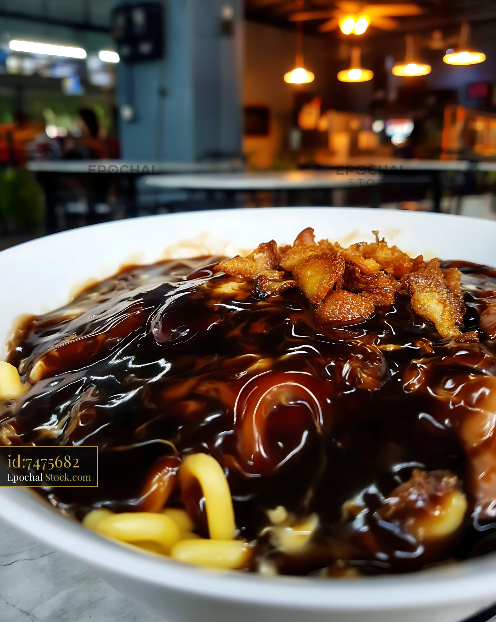Delicious Lor Mee Soup with Crispy Toppings in Food Court - stock photo