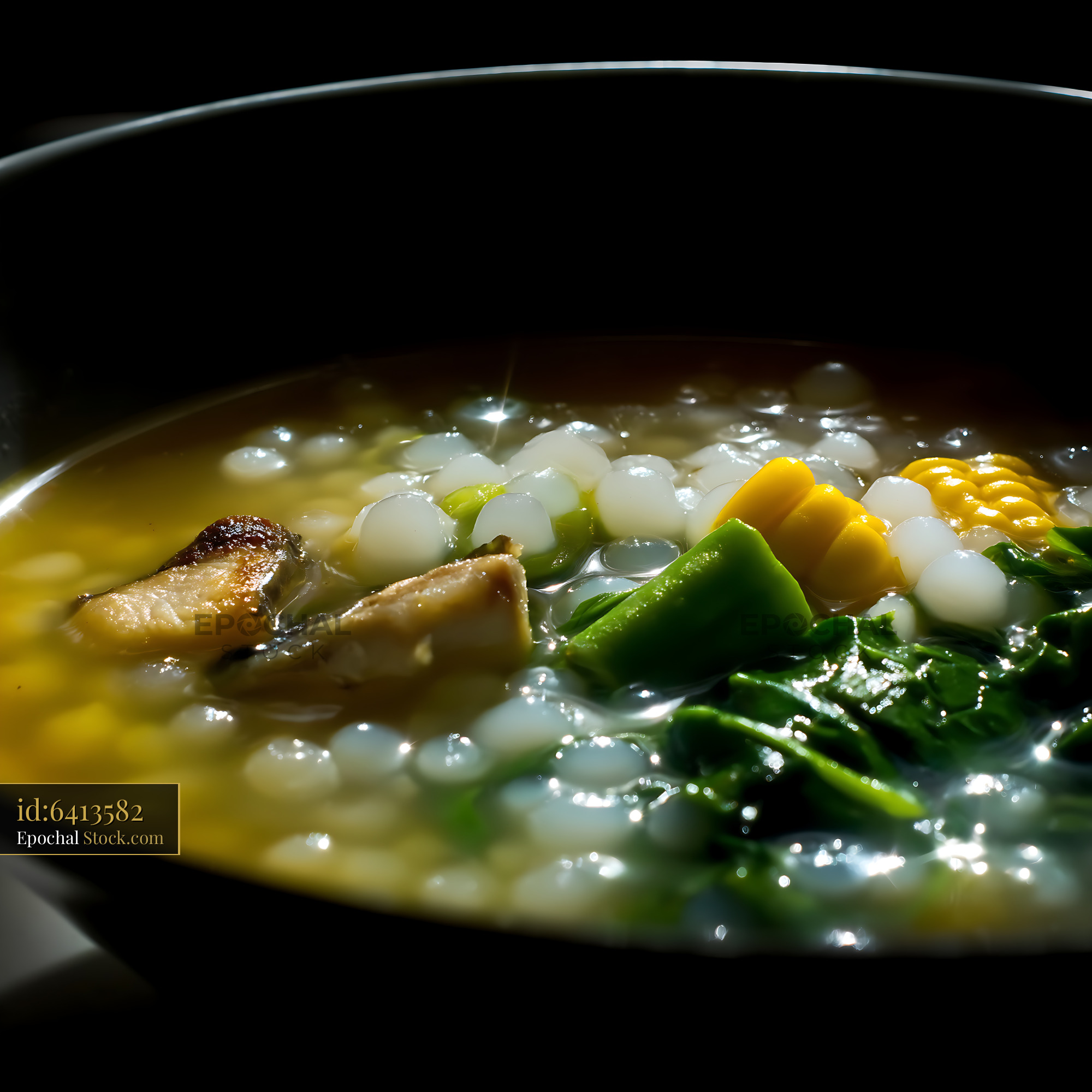 Hearty Lor Mee Soup with Fish, Corn, and Greens - stock photo