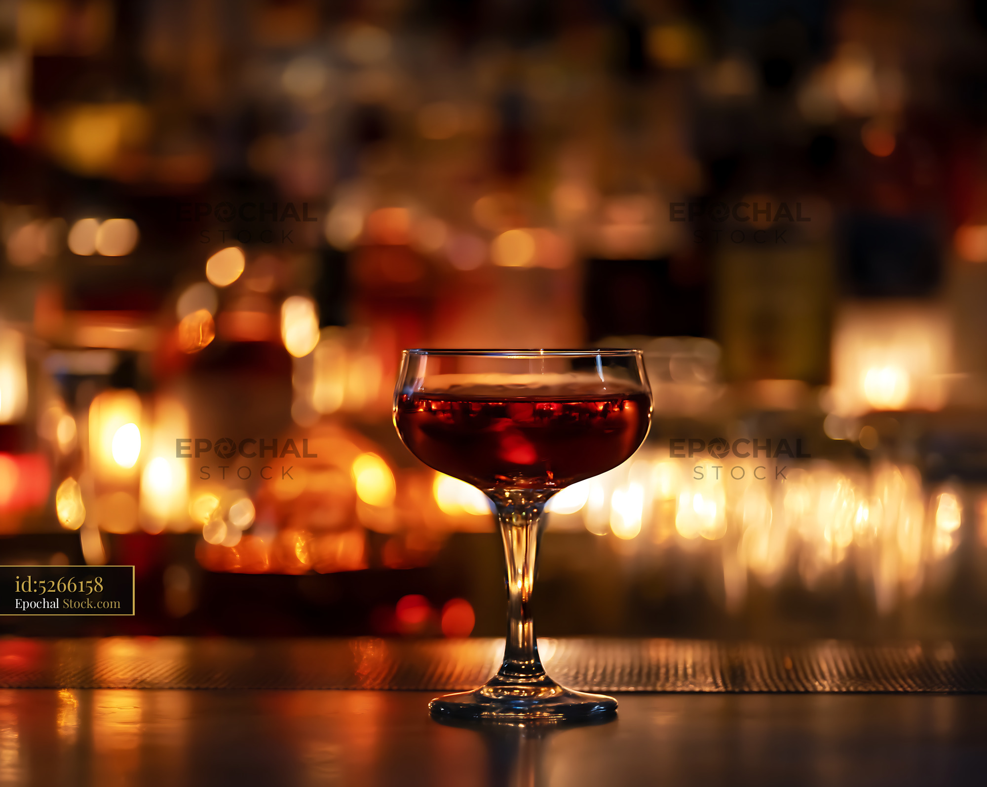 Bushwick Cocktail in Coupe Glass on Bar - stock photo