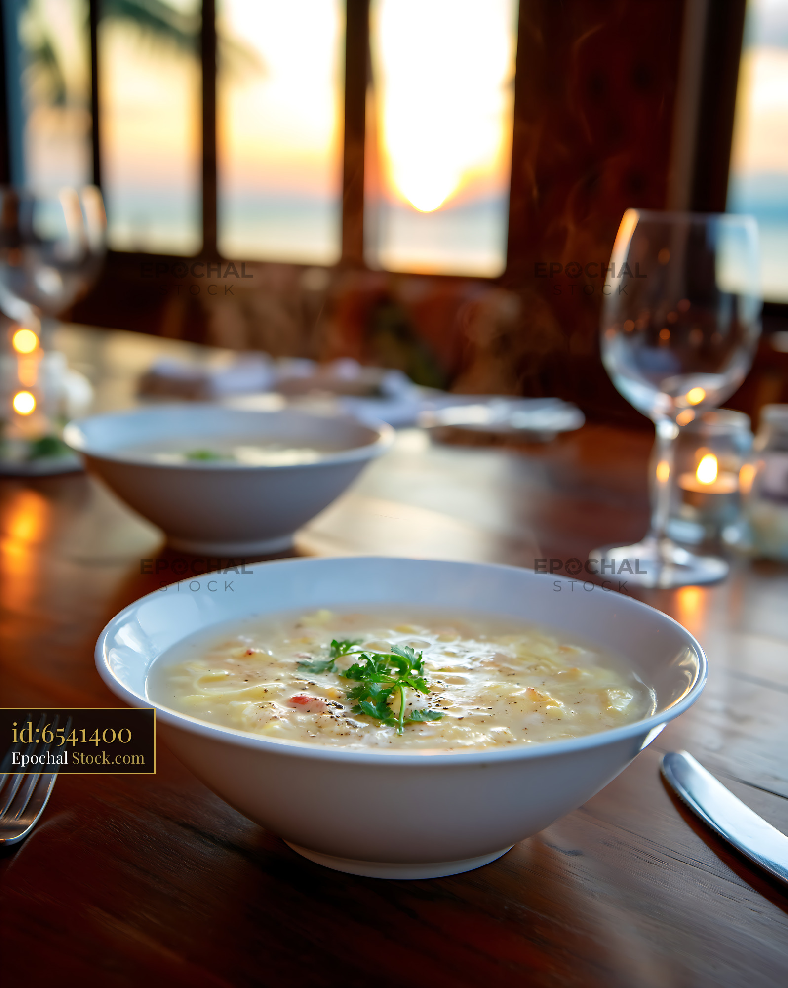 Sup Mang Cua Soup Steaming at Sunset Dining Table - stock photo