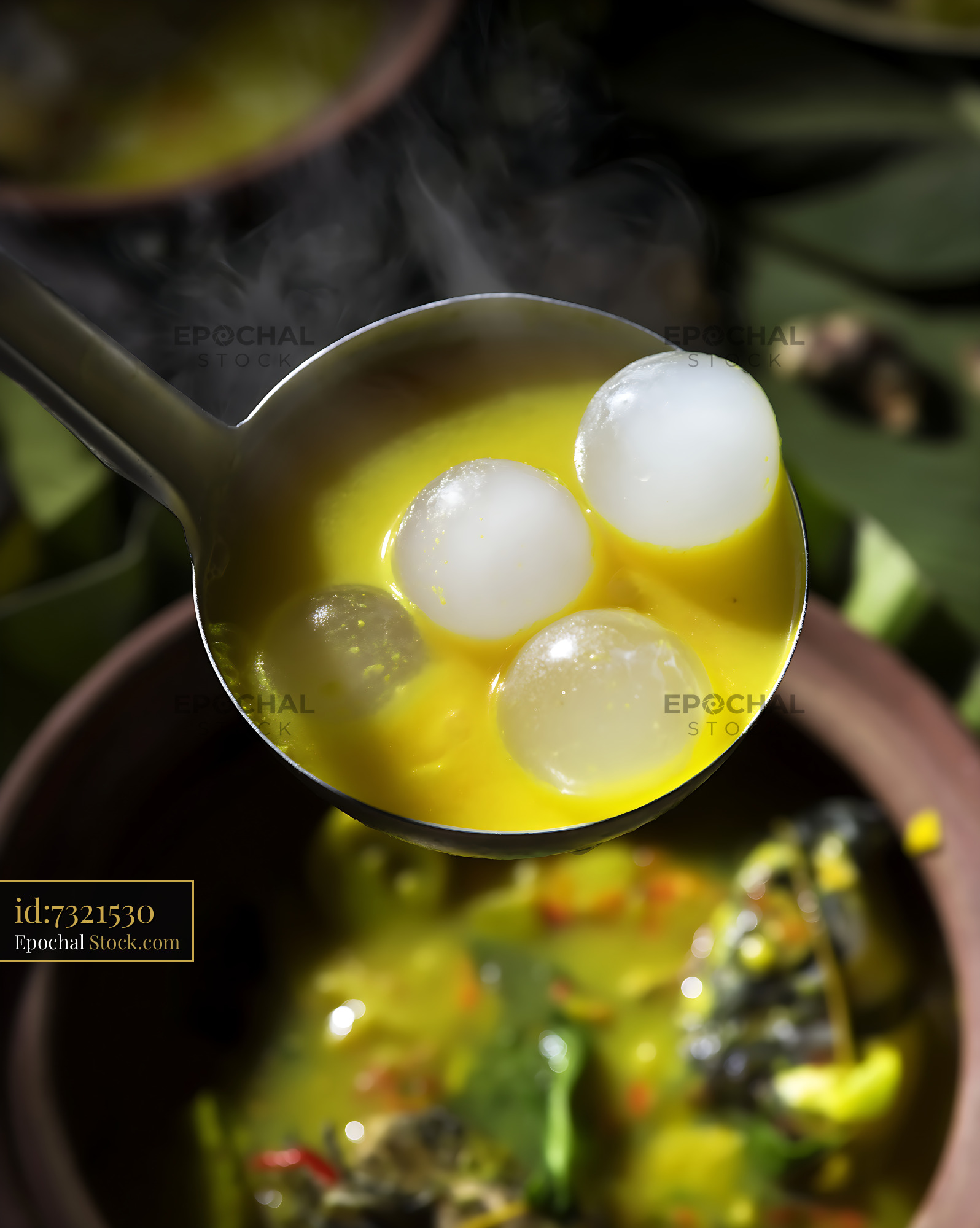 Steaming Kapurung Soup with Sago Pearls in Ladle - stock photo