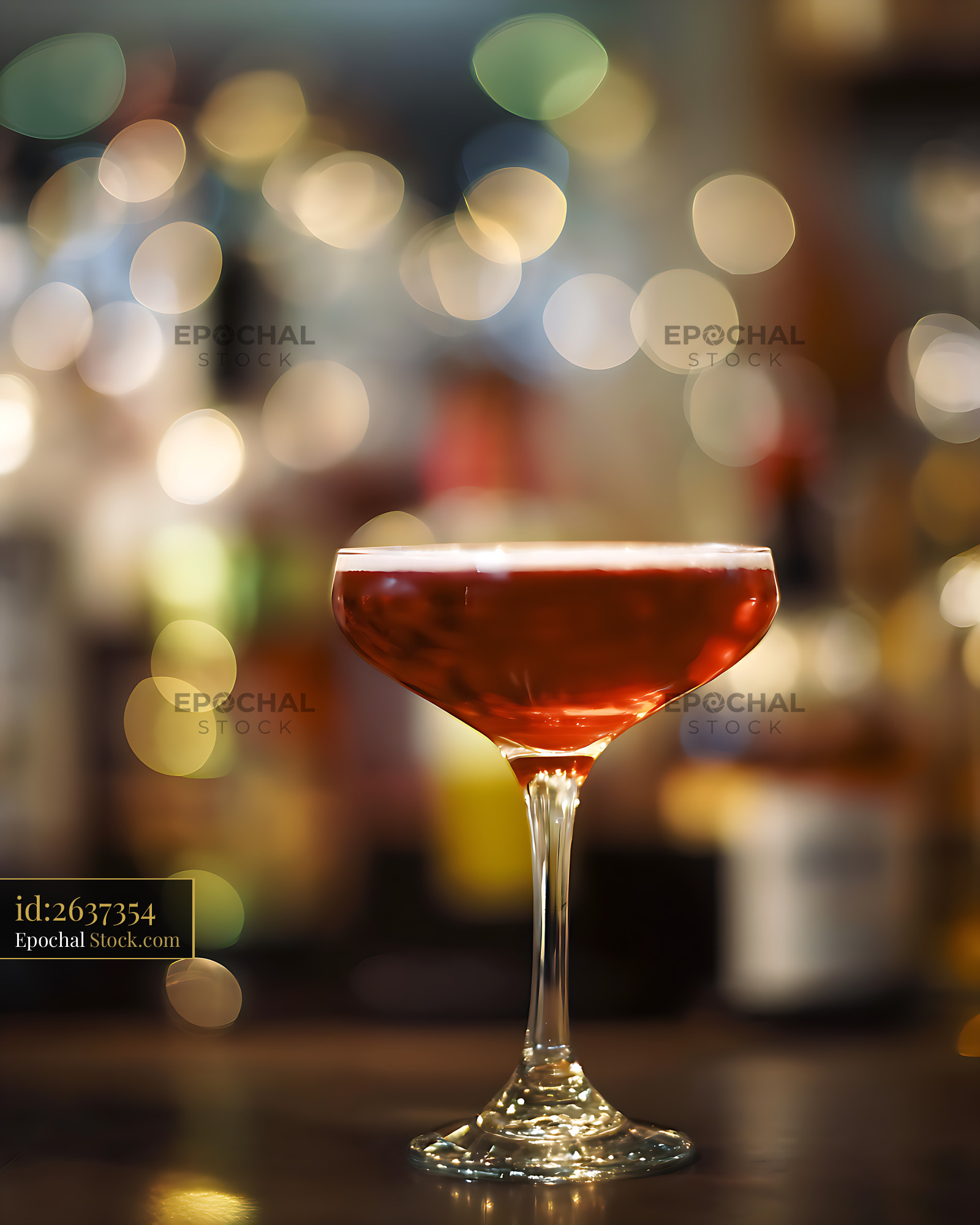 Elegant Red Cocktail in Coupe Glass with Bokeh Lights - stock photo