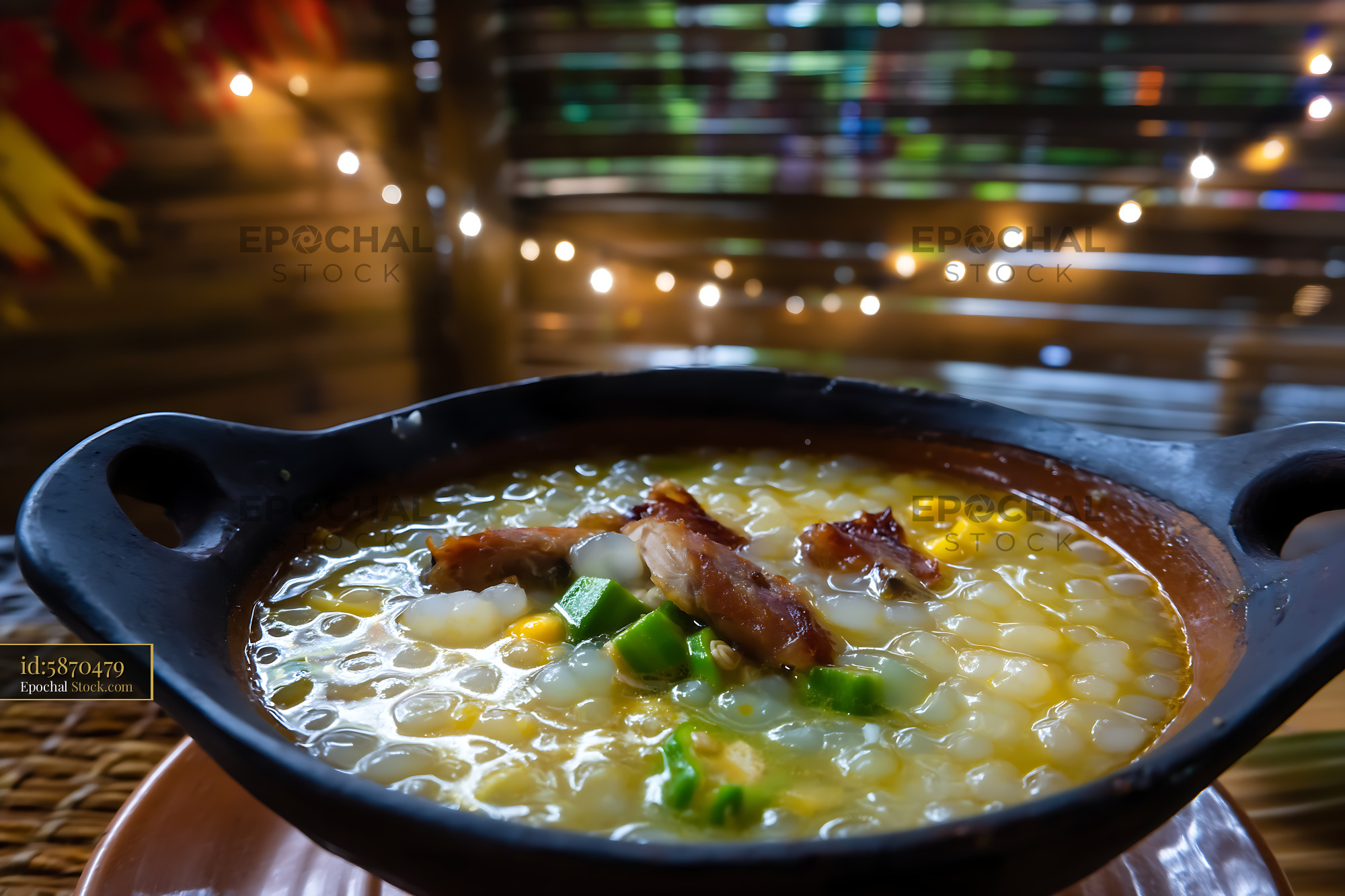 Traditional Lor Mee Soup in Clay Pot with String Lights - stock photo