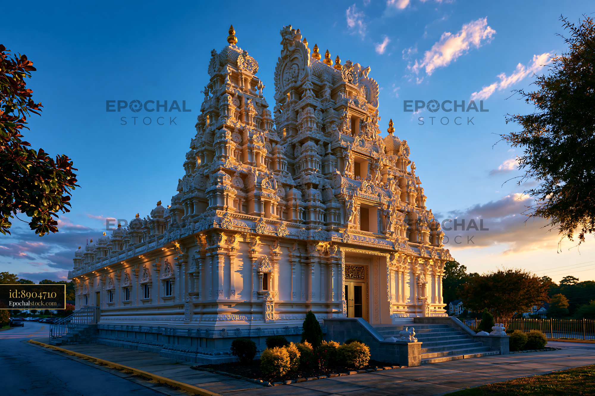 Watermarked full-resolution preview of Ornate Hindu temple illuminated by evening light