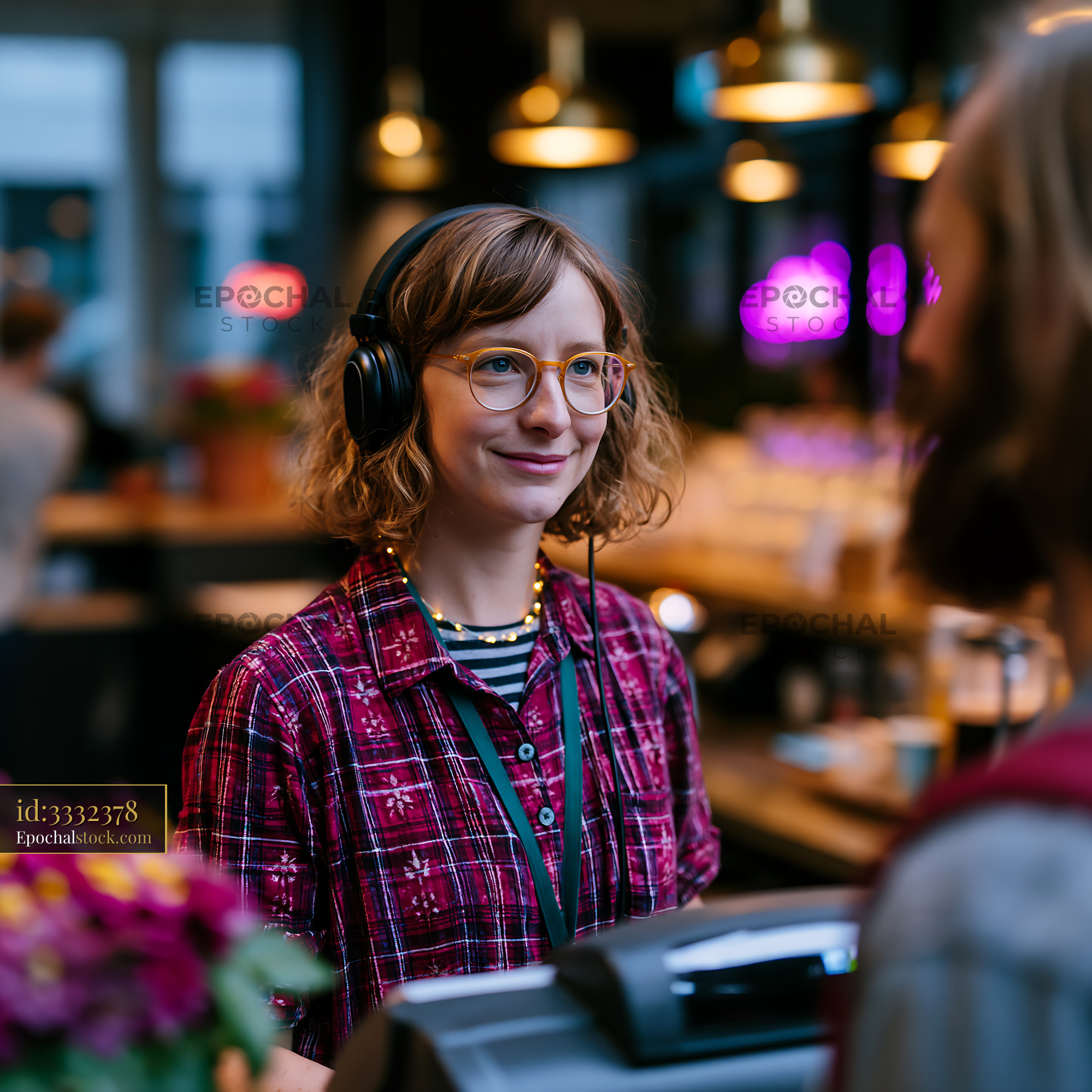 Watermarked full-resolution preview of Barista serving coffee at a busy cafe in the evening