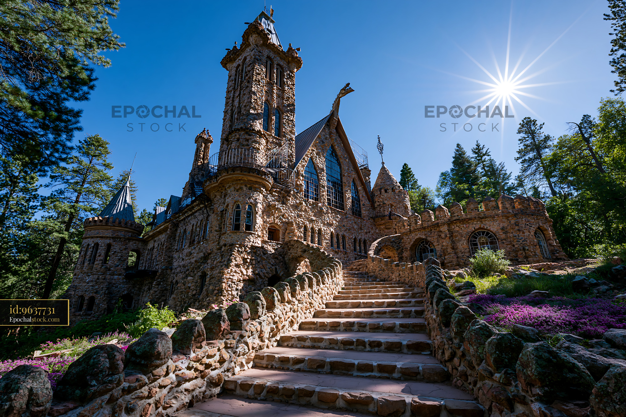 Watermarked full-resolution preview of Majestic stone castle surrounded by trees and flowers