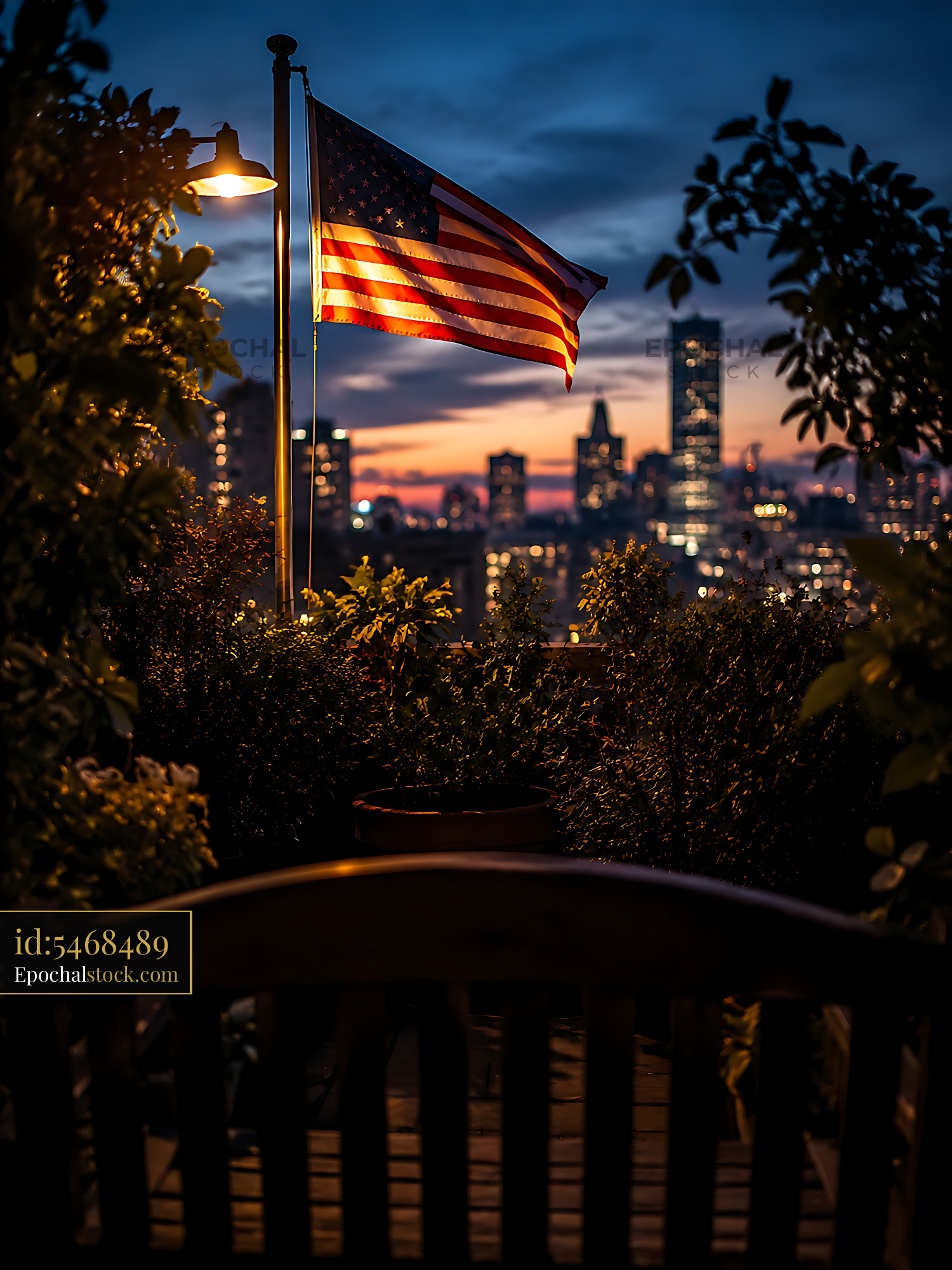 Flag Waving at Sunset With City Skyline in Background - stock photo