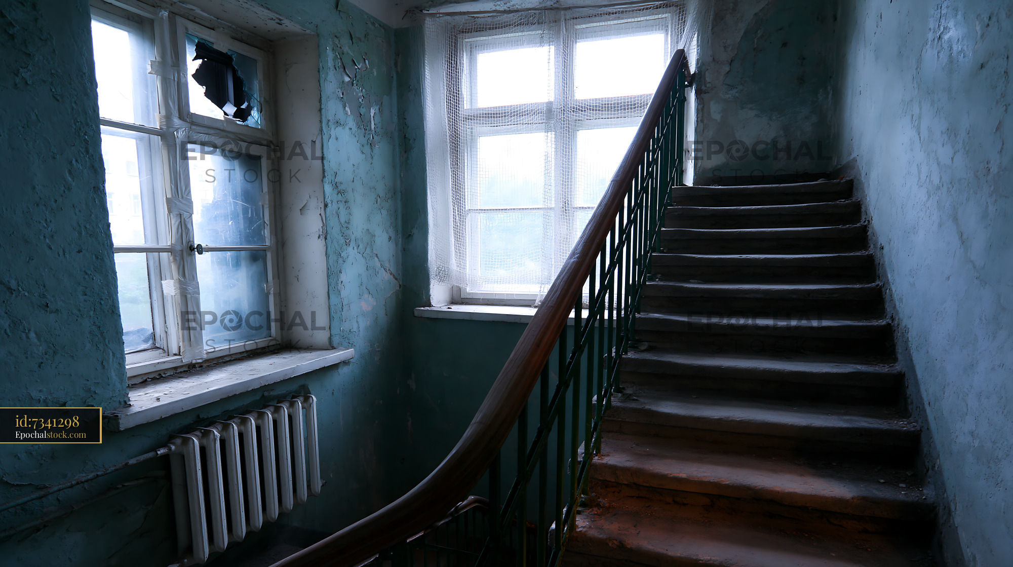 Watermarked full-resolution preview of Staircase in an abandoned building with broken window