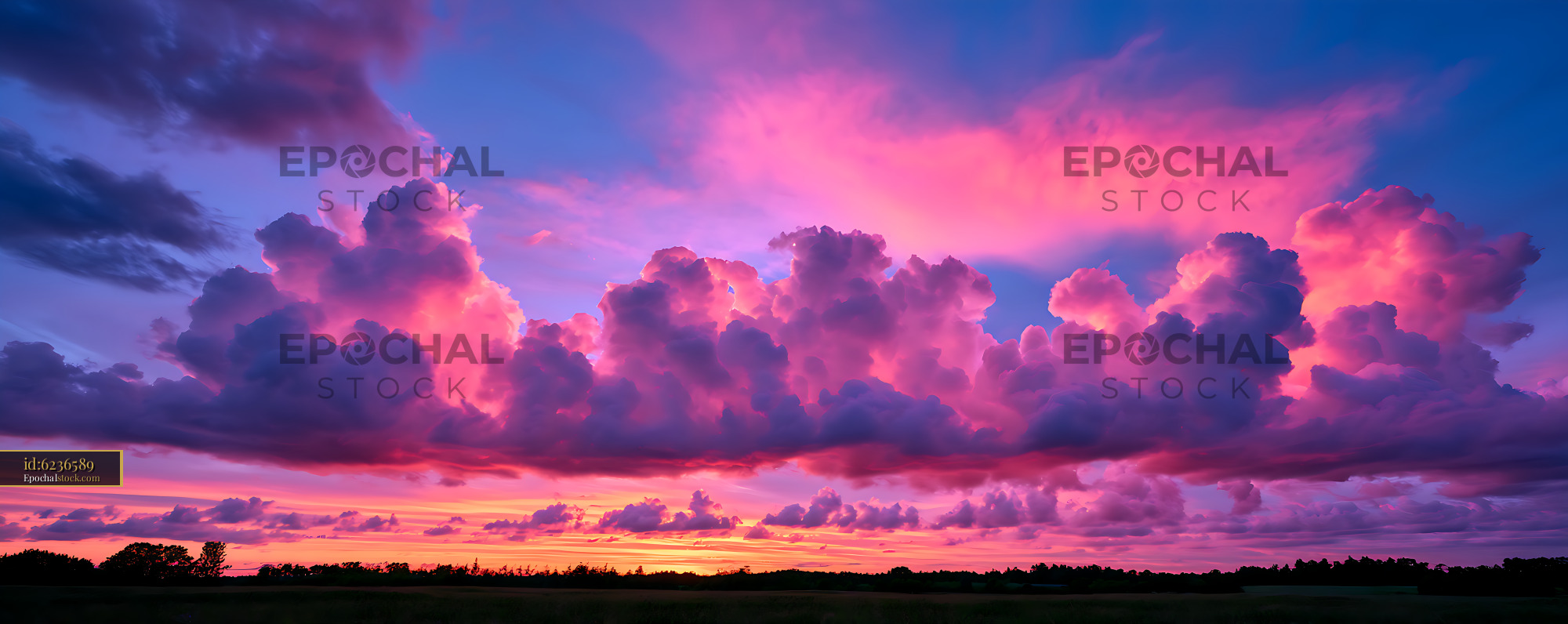 Watermarked full-resolution preview of Dramatic colorful sunset cloudscape over rural landscape