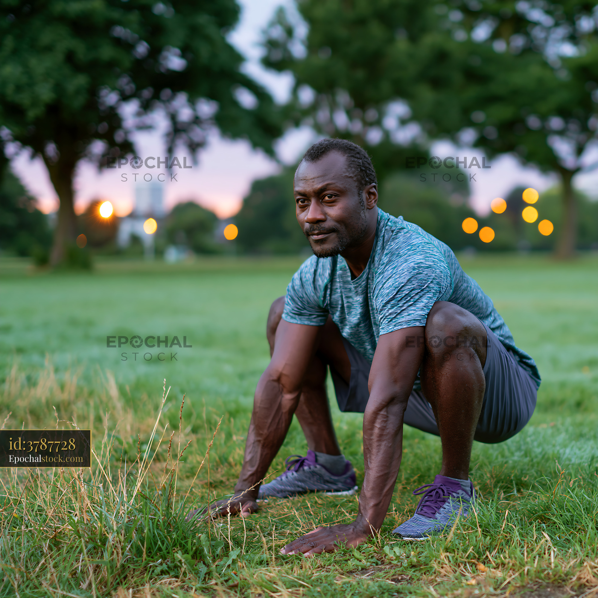 Watermarked full-resolution preview of Person exercising outdoors in the evening light in a park setting