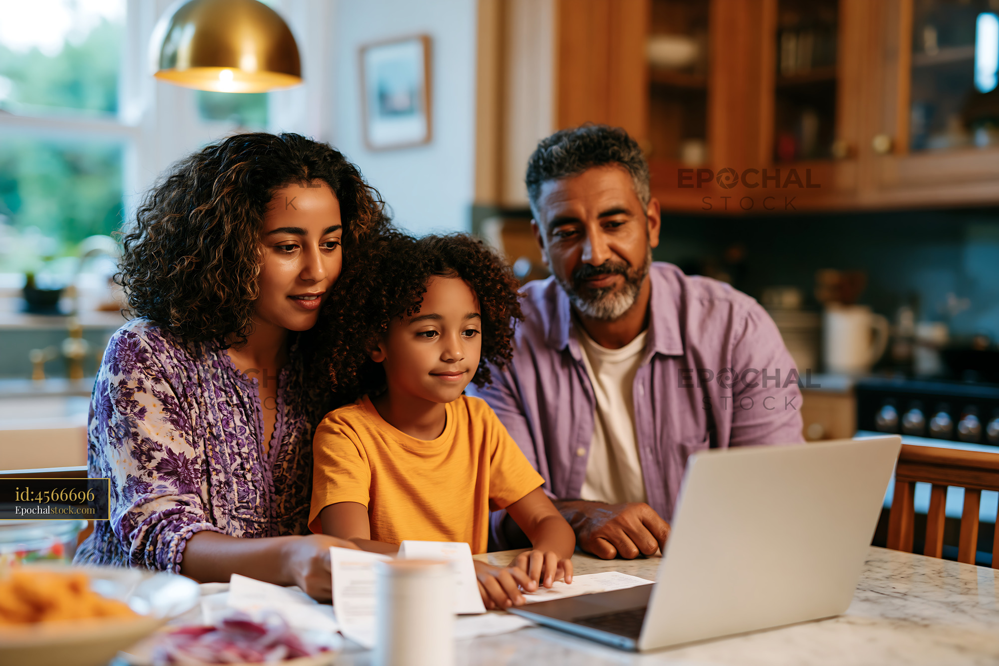 Watermarked full-resolution preview of Family working together at home on a laptop