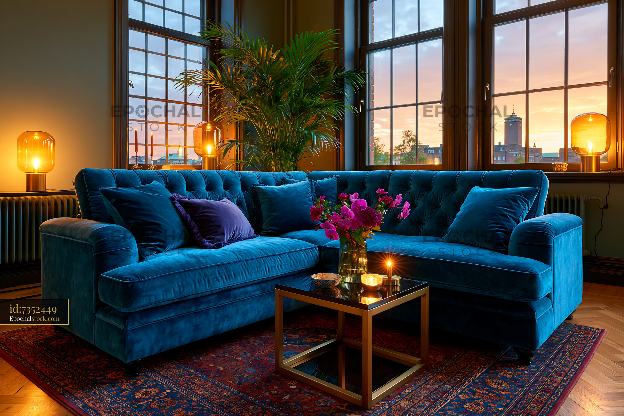 Minimalist Living Space With Blue Velvet Sofa and Sunset View - stock photo