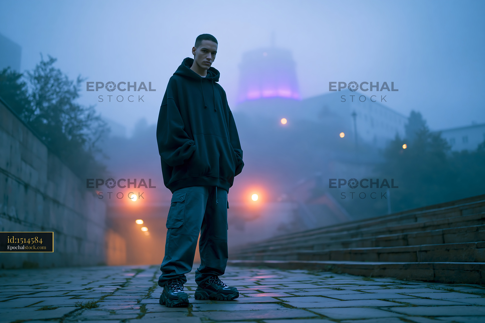 Watermarked full-resolution preview of Person standing in fog on street at night with purple lights