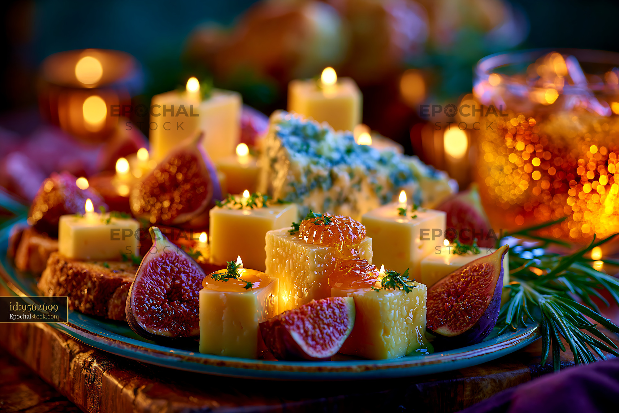 Watermarked full-resolution preview of Cheese platter with candles and figs on a wooden table