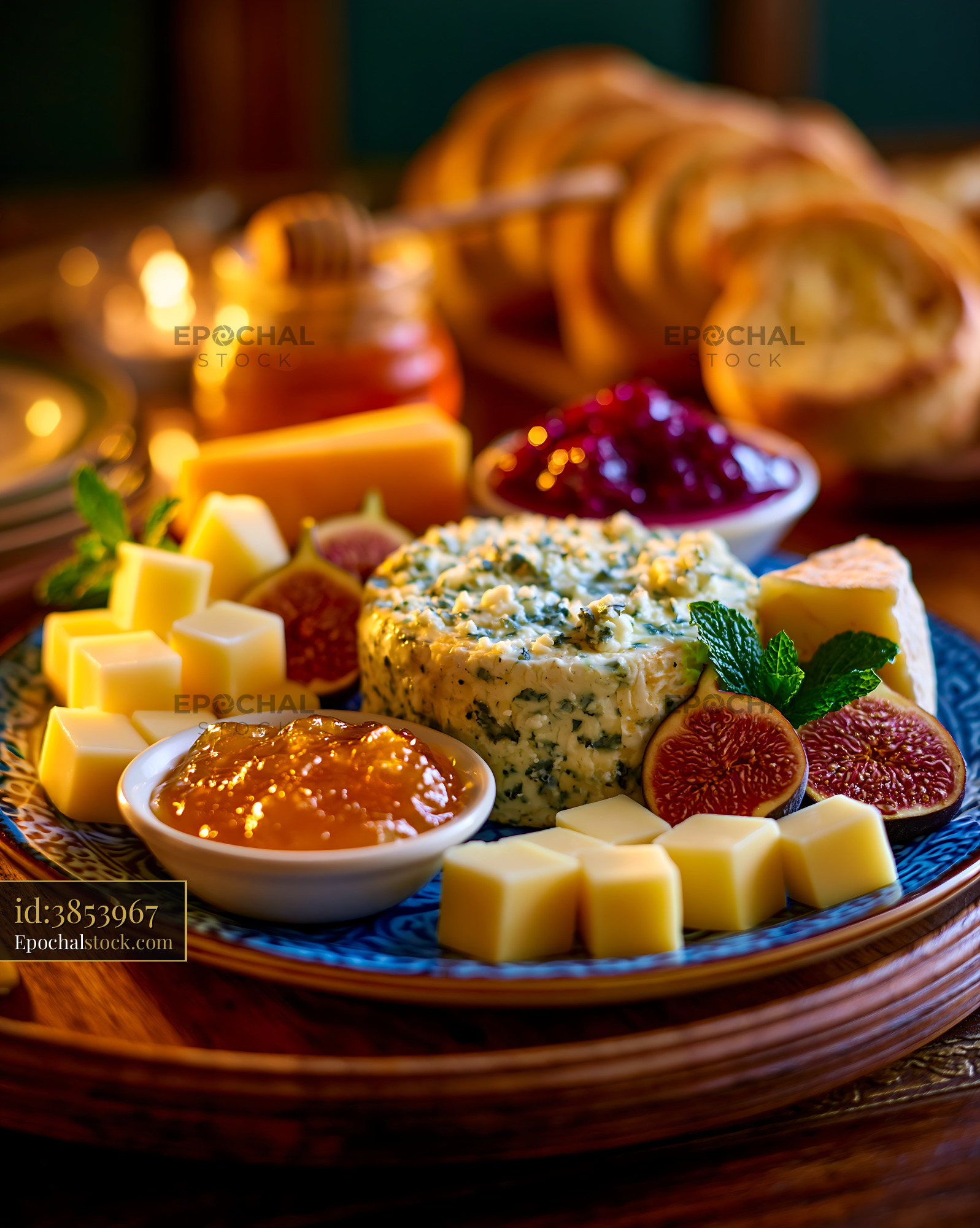 Watermarked full-resolution preview of Gourmet cheese board with figs and fruit spread