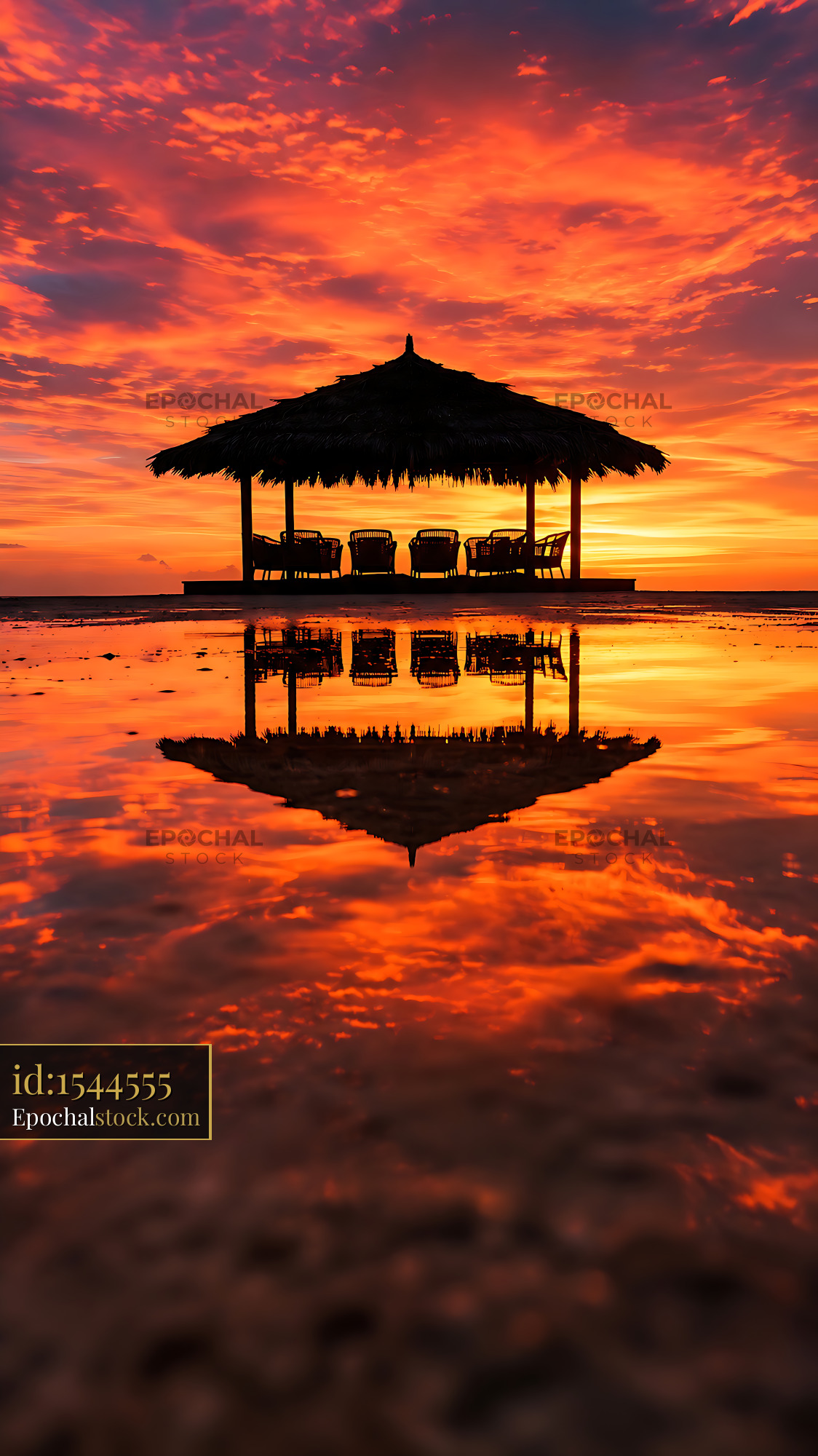 Watermarked full-resolution preview of Sunset at a beach hut with reflections on the water