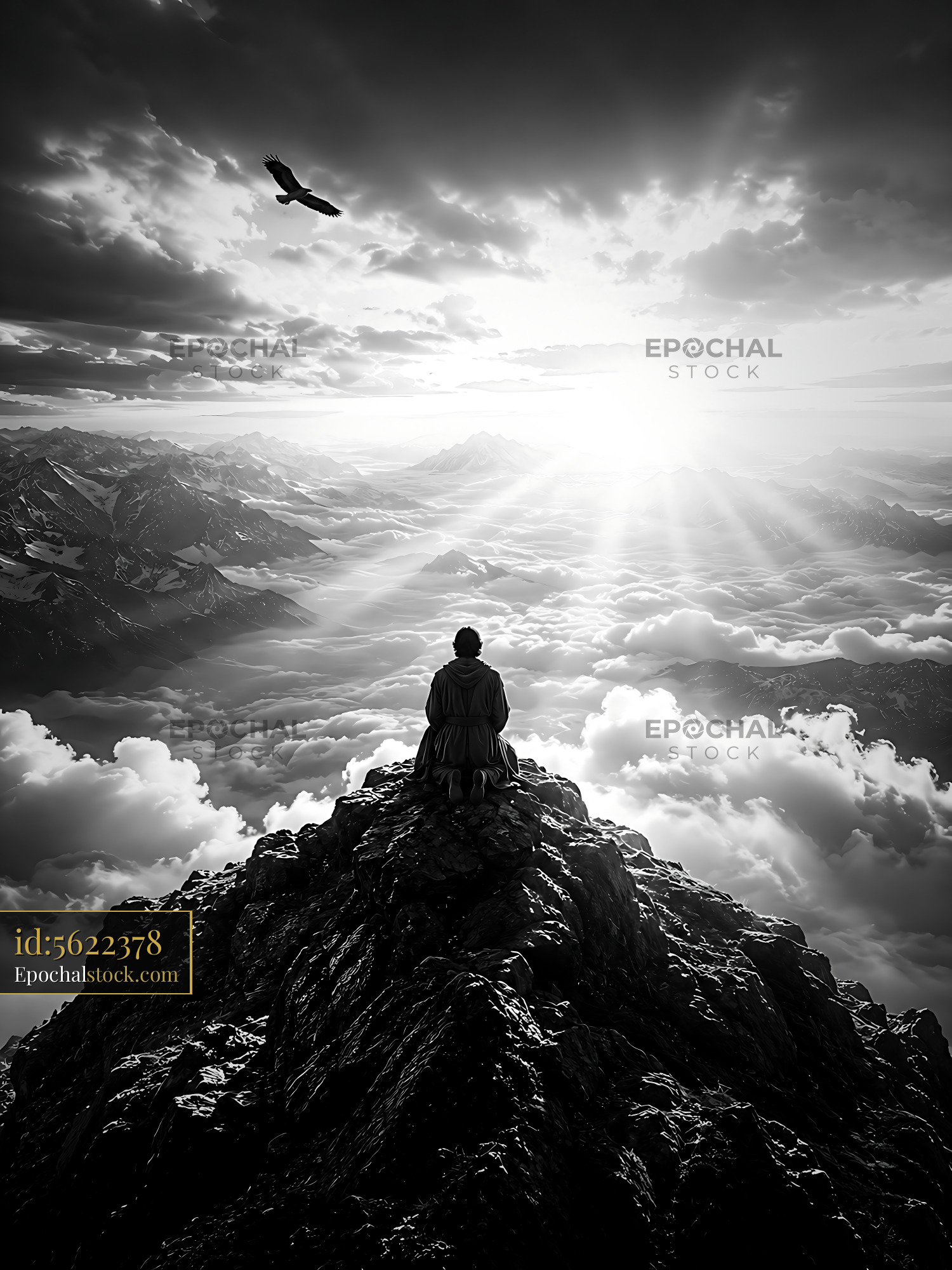 Watermarked full-resolution preview of Man sitting on a mountain peak looking at a cloudy landscape