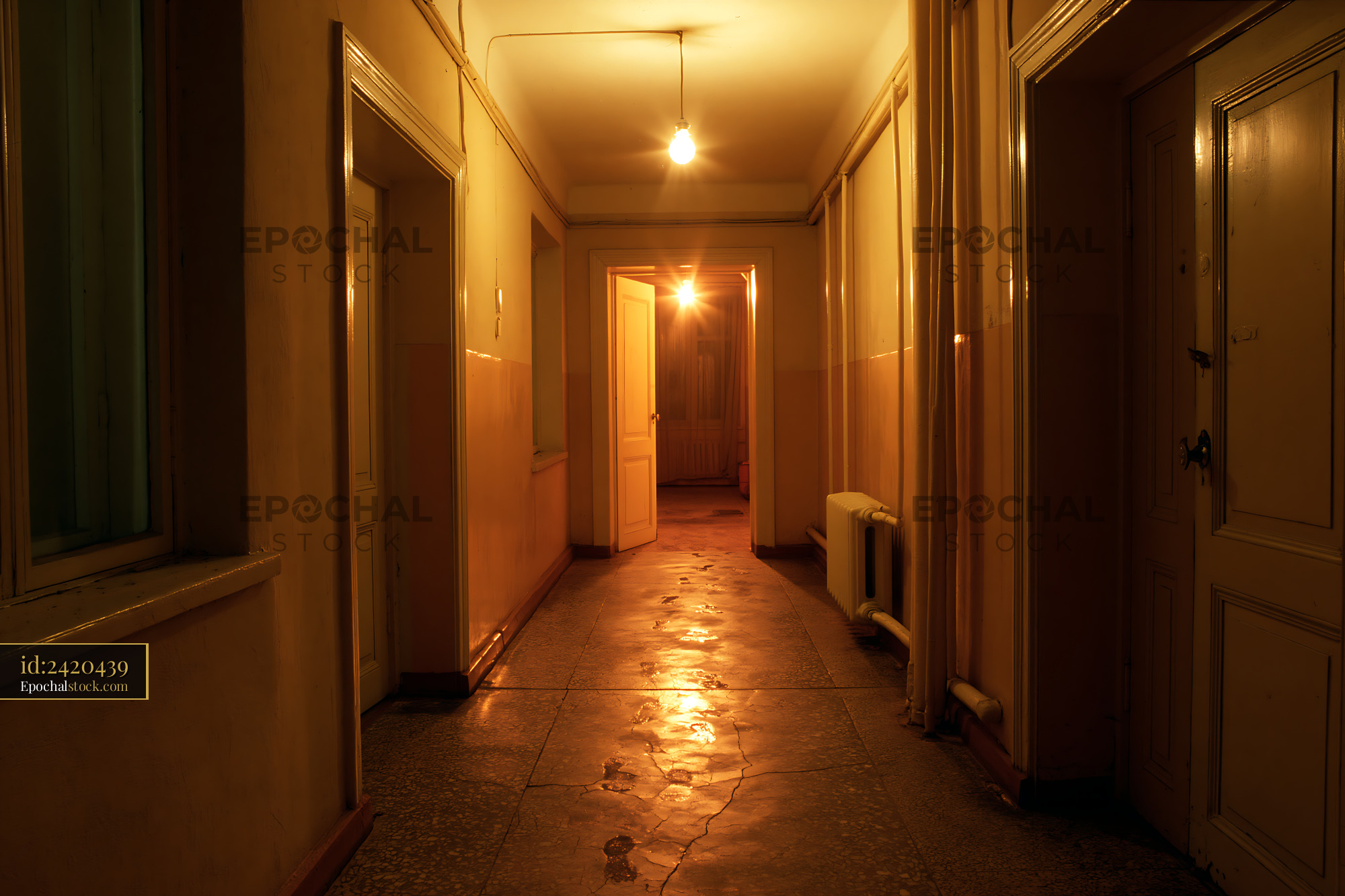 Watermarked full-resolution preview of Empty corridor illuminated by warm ceiling lights