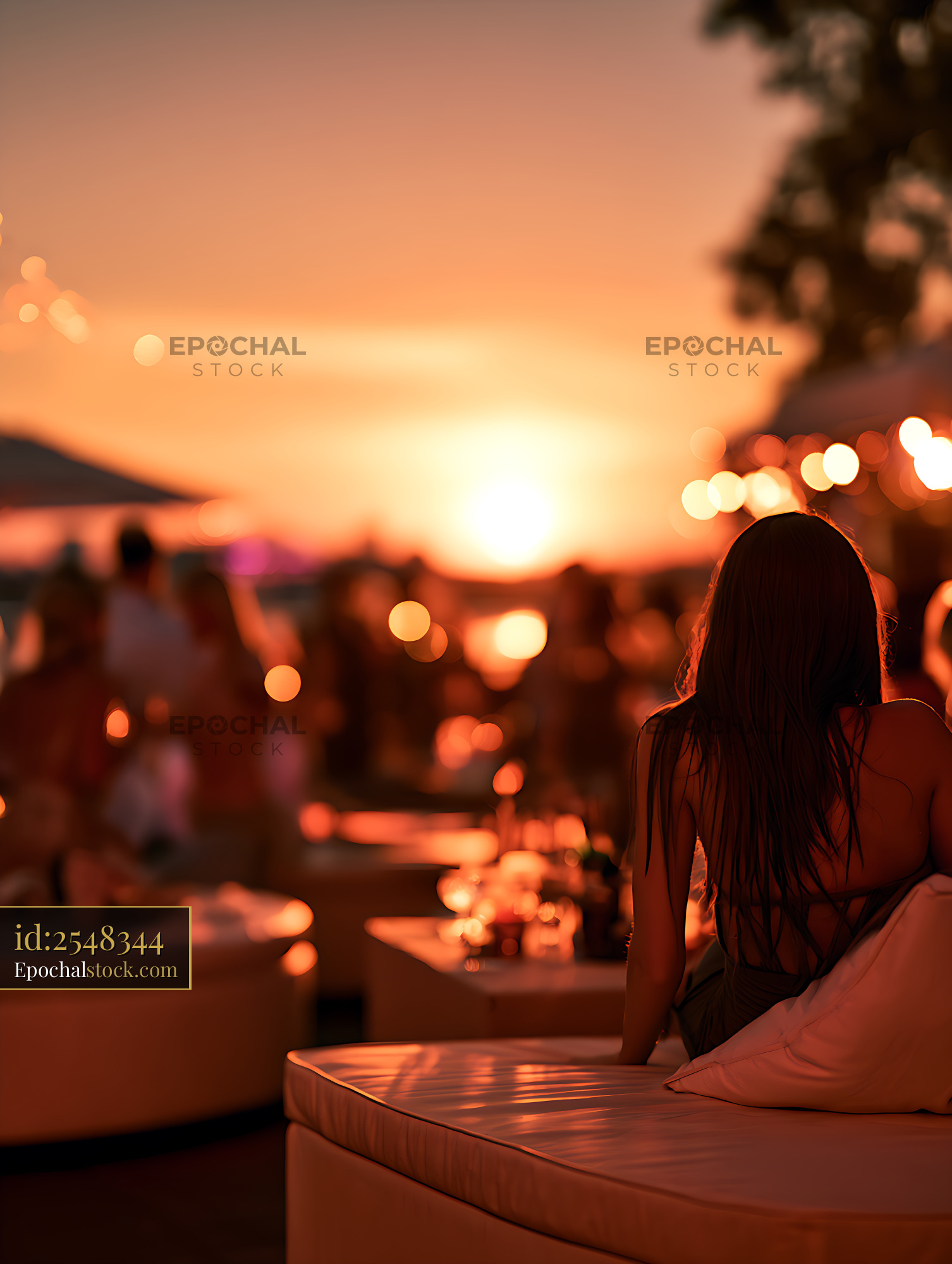 Watermarked full-resolution preview of Woman Sitting on Rooftop at Sunset
