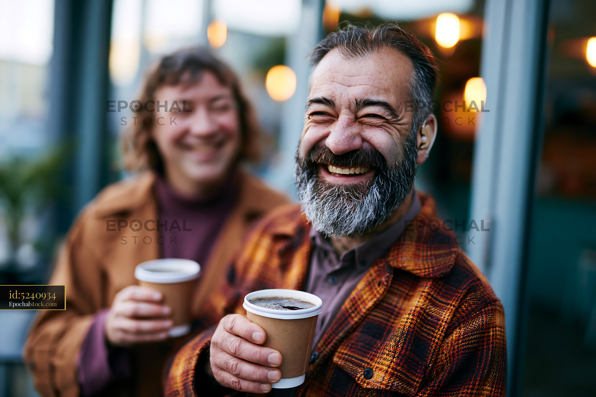 Watermarked full-resolution preview of Happy people enjoying coffee at a cafe during the day