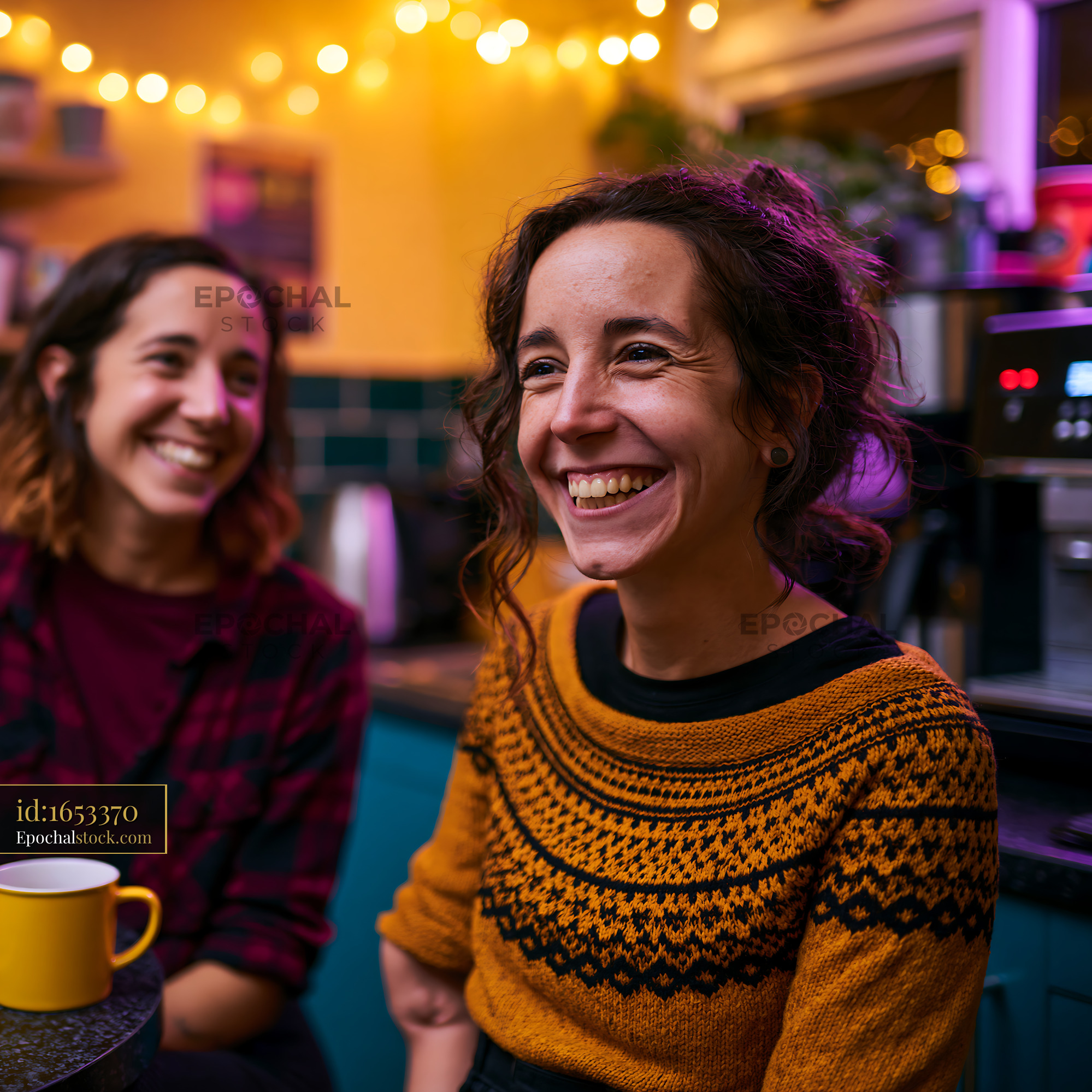 Watermarked full-resolution preview of Friends enjoying a conversation in a cozy cafe setting