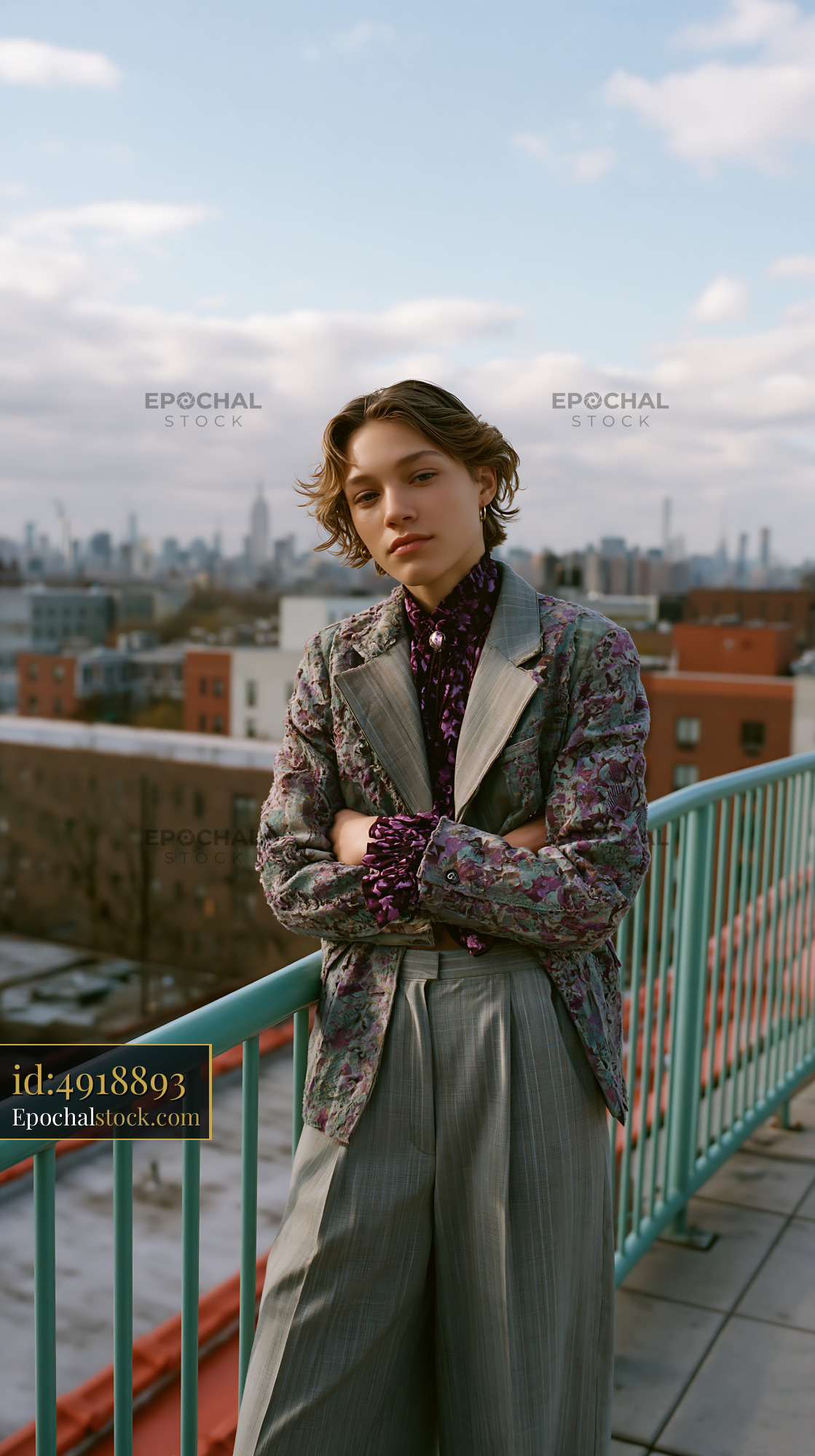 Watermarked full-resolution preview of Fashion model poses on rooftop with city skyline in background